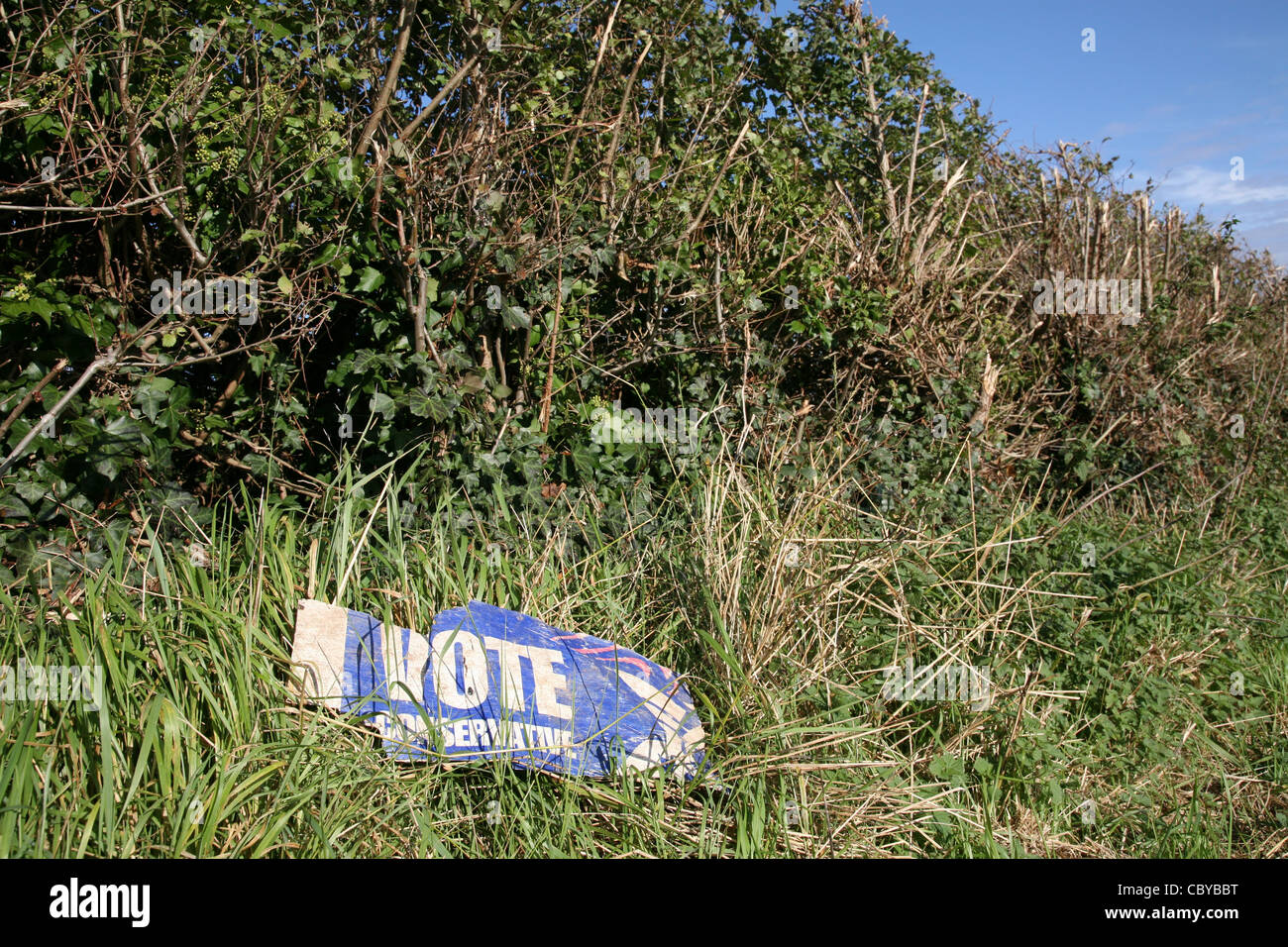 conservative sign dumped in field Stock Photo