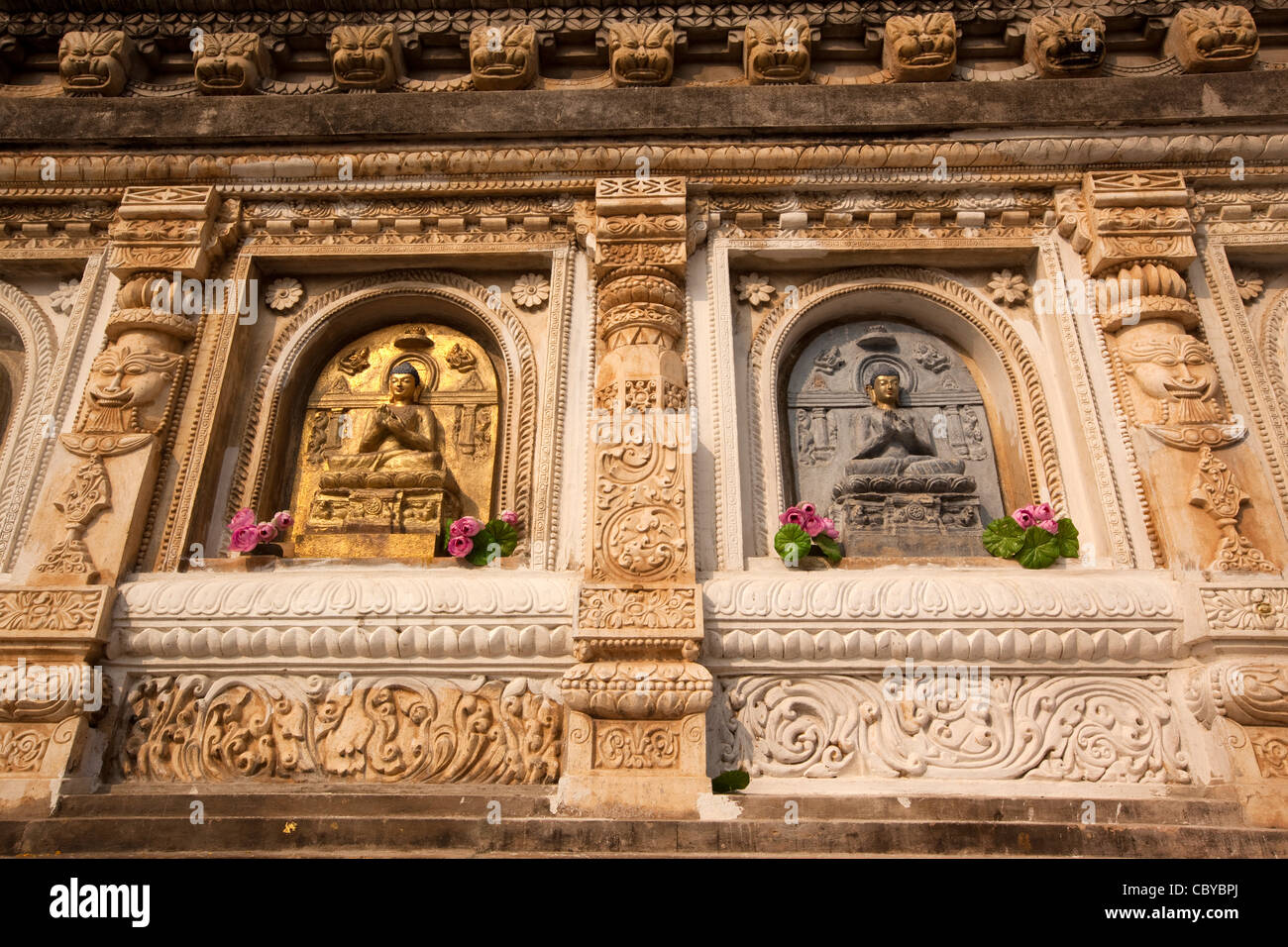 India, Bihar, Bodhgaya, Mahabodhi Temple, Buddhist sculptures on base of the temple Stock Photo