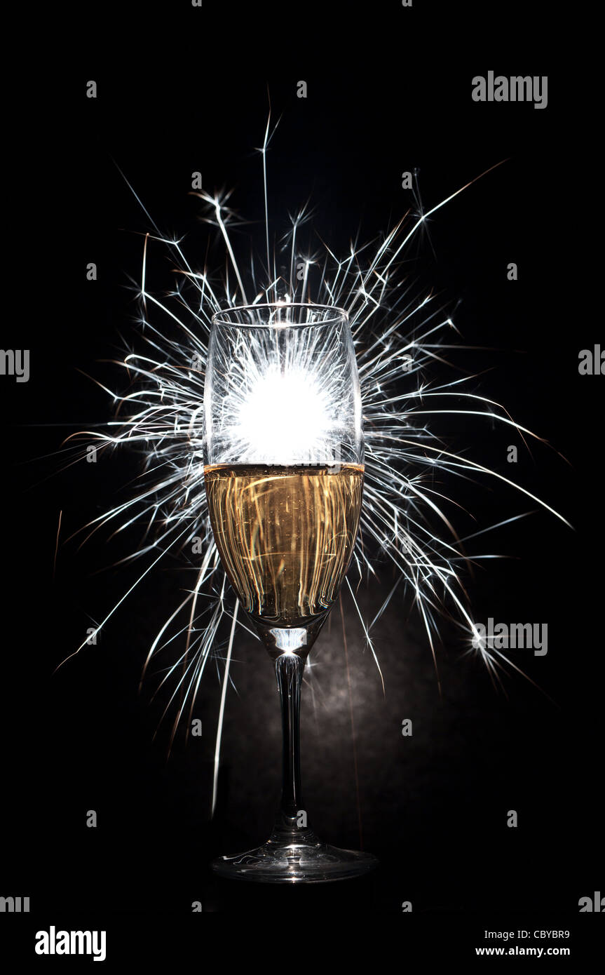 glass of champagne with fire works Stock Photo Alamy