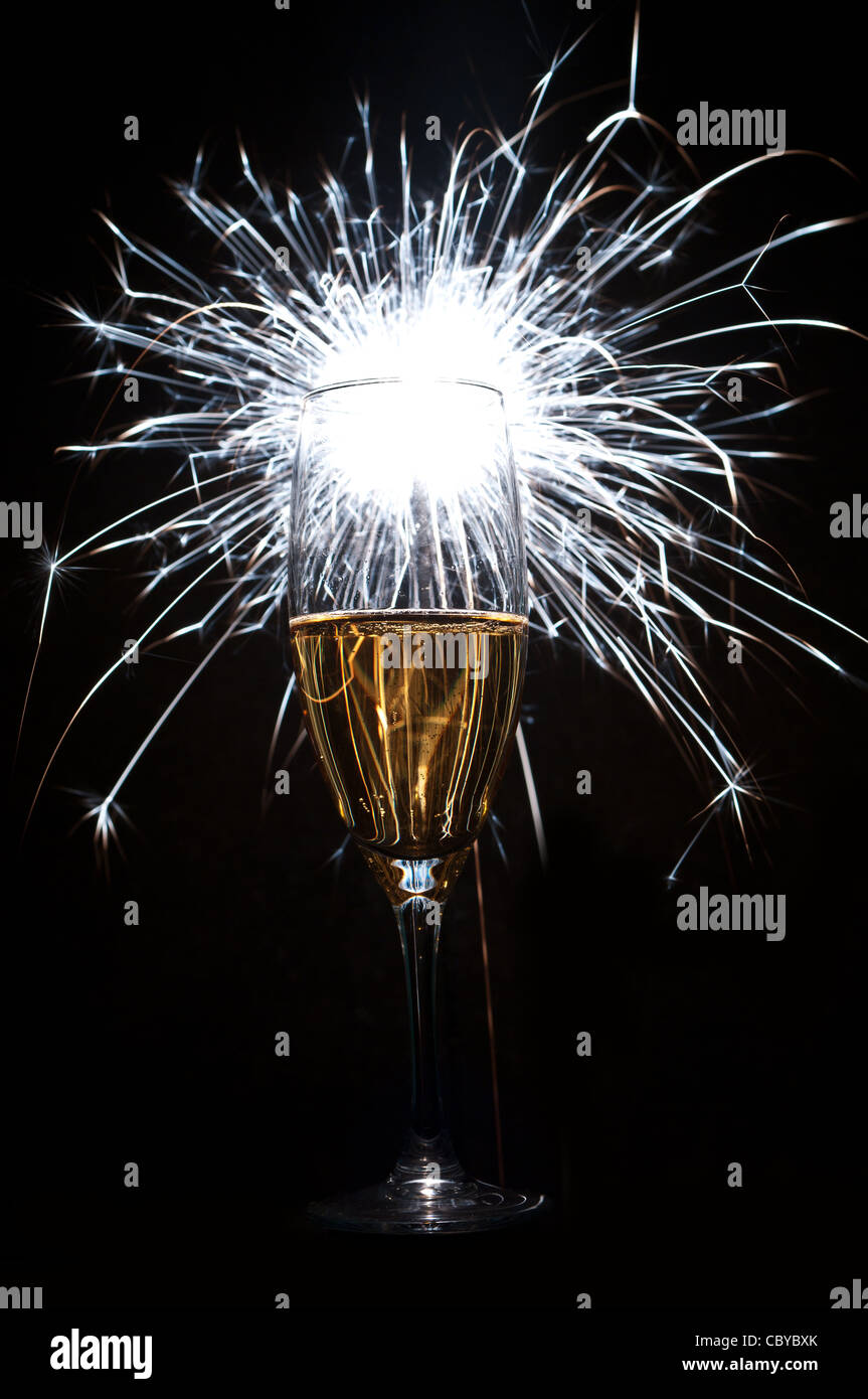 glass of champagne with fire works Stock Photo Alamy