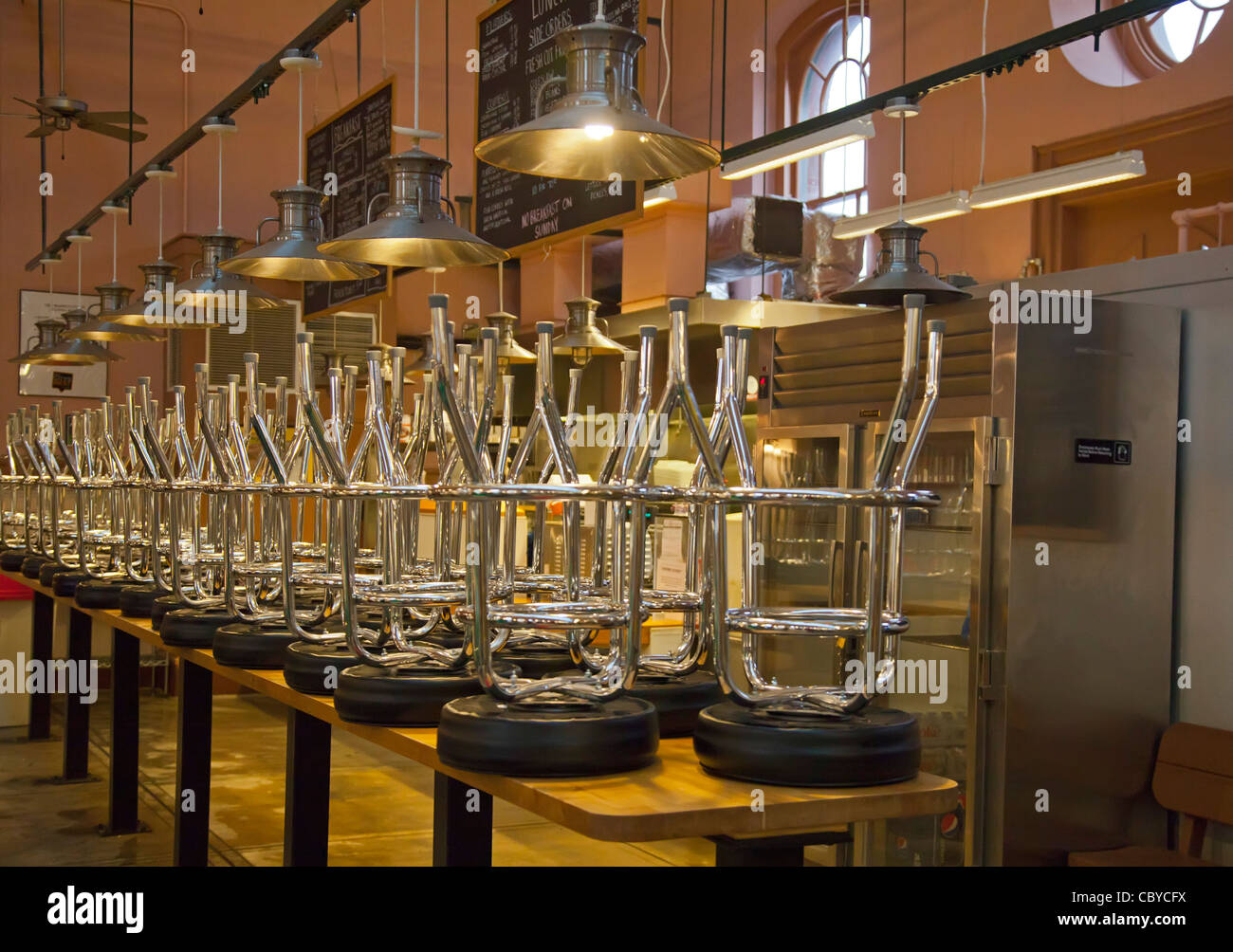 Washington, DC Bar stools on top of tables at the end of the day at a