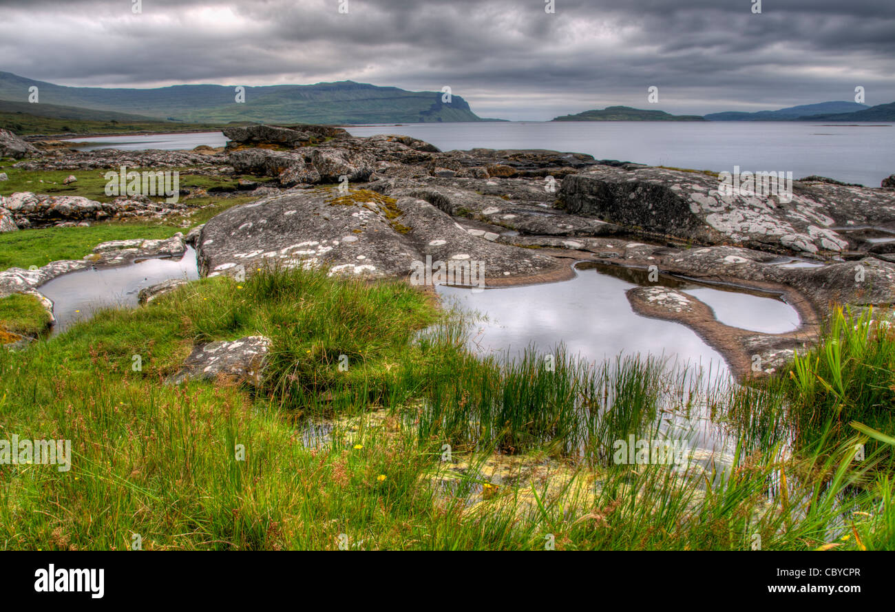 a moody image of loch na keal isle of mull with nice foreground interest Stock Photo