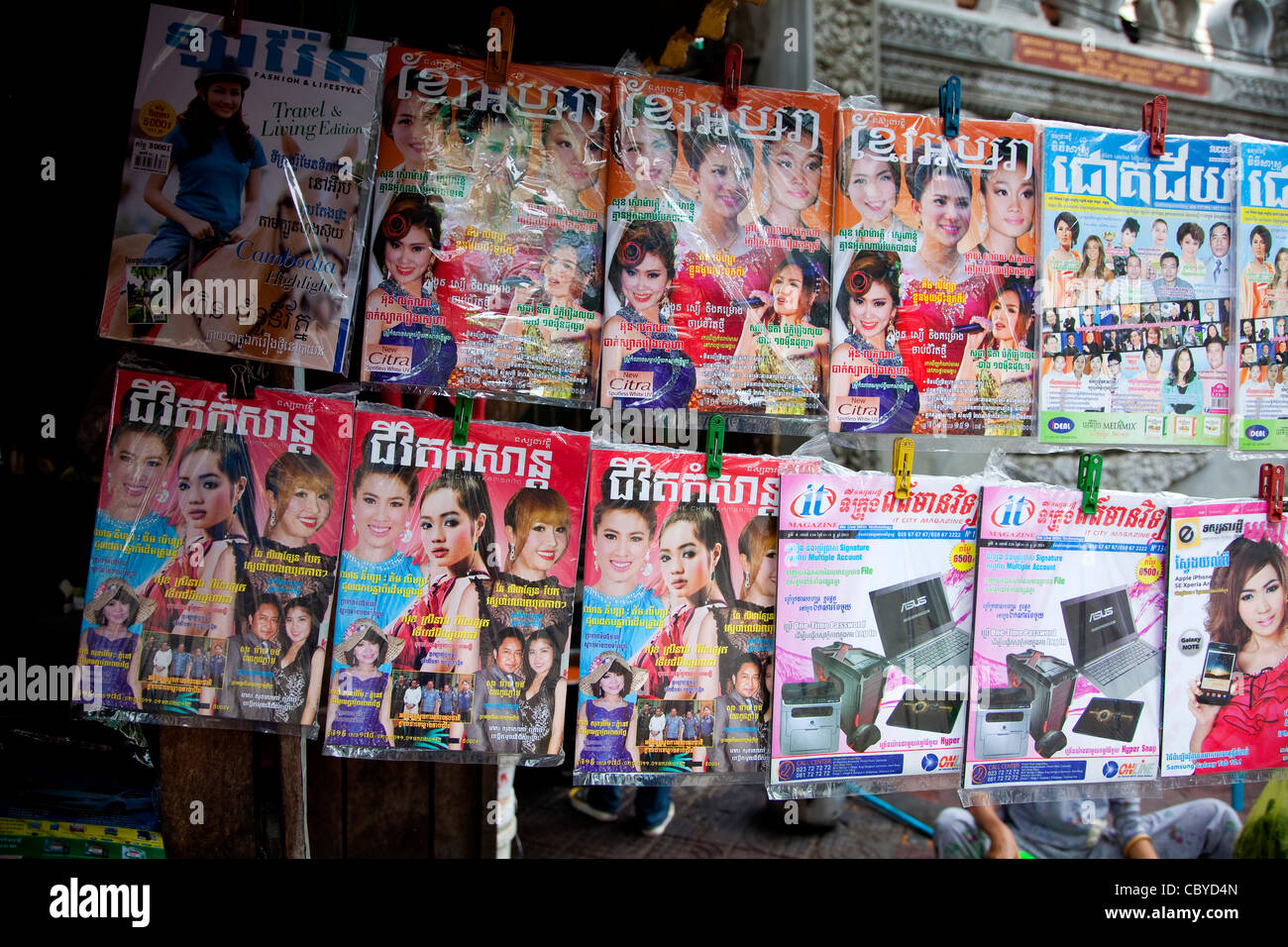 Newsstand selling newspapers and magazines on the street, Phnom Penh ...