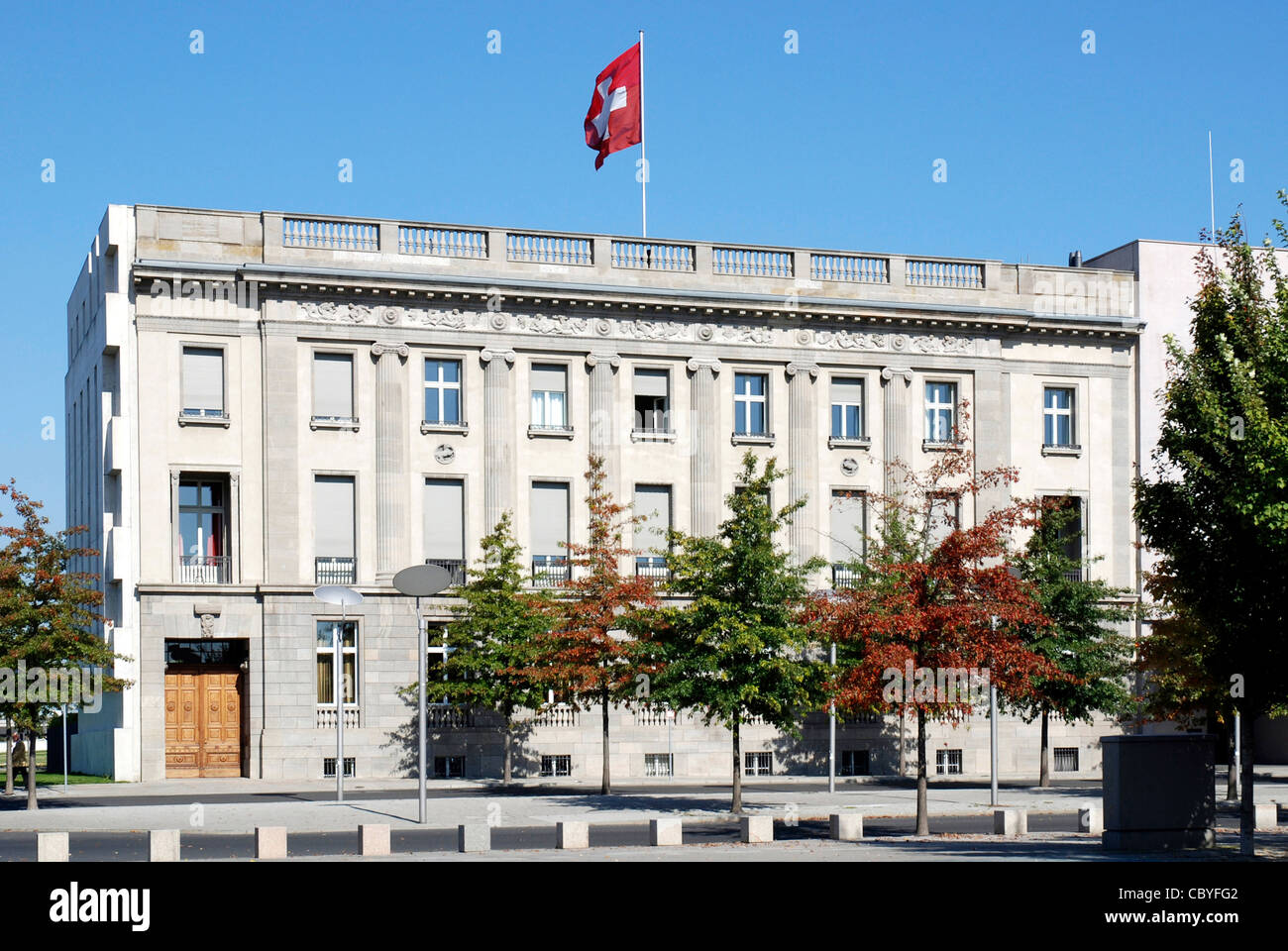 Embassy of Switzerland in Berlin with the Swiss national flag. Stock Photo