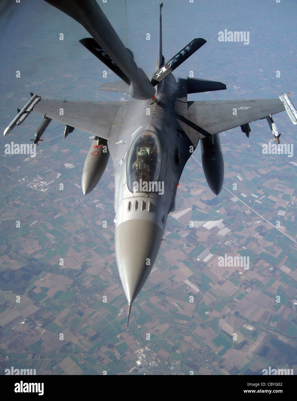 Prior to flying operations being grounded, an F-16 Fighting Falcon from Spangdhalem Air Base, Germany, refuels off a 100th Air Refueling Wing KC-135 Stratotanker during exercise Brilliant Ardent April 15, 2010, at Royal Air Force Mildenhall, England. Stock Photo