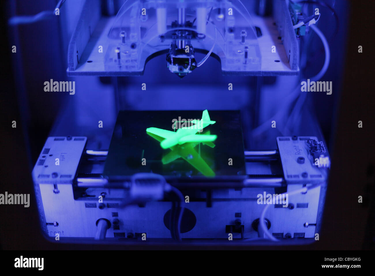 a Makerbot Thing-O-Matic 3d printer prints a model 3d plane. Stock Photo