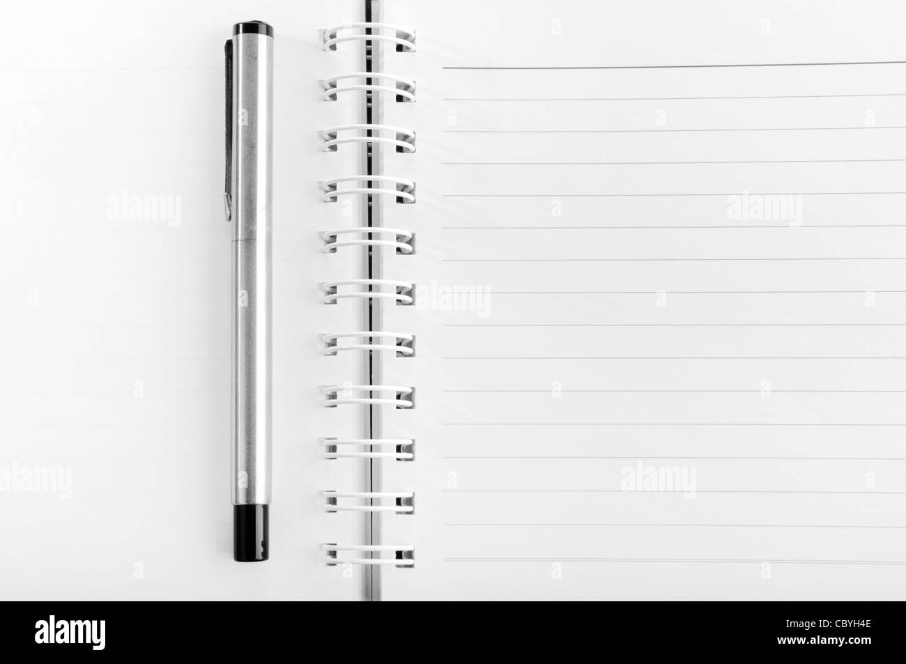 Blank notepad with a pen Stock Photo
