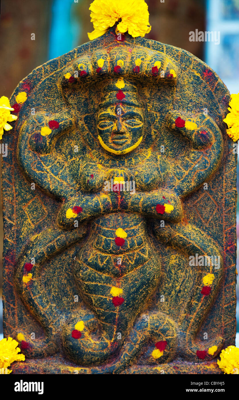Hindu shrine stone depicting the Indian god Vishnu in the south indian village of Puttaparthi, Andhra Pradesh, India Stock Photo