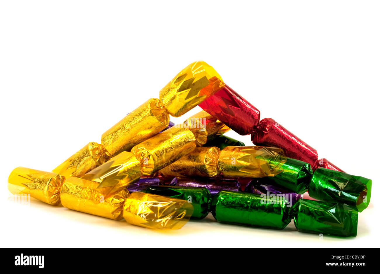 Pile of christmas crackers isolated on white background Stock Photo Alamy