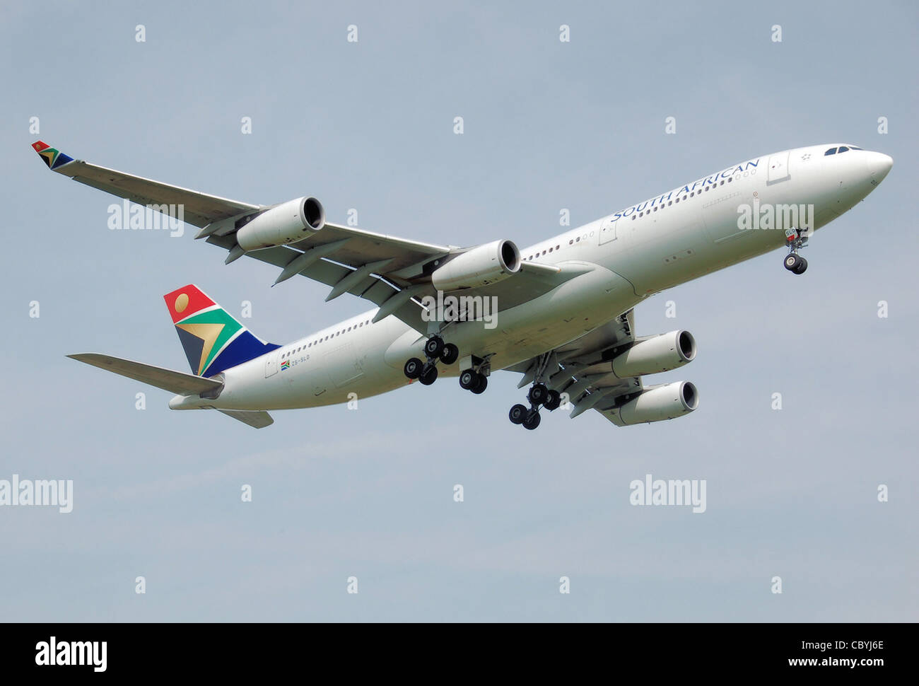 South African Airways Airbus A340-200 (ZS-SLD) lands at London Heathrow Airport, England. Stock Photo