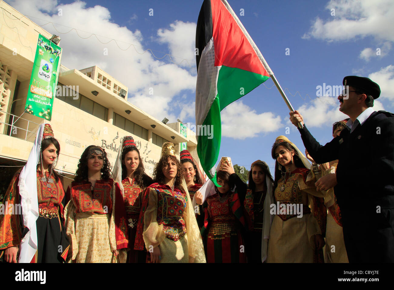 Christmas in Bethlehem, Palestinian girls in traditional dresses in Manger Square Stock Photo