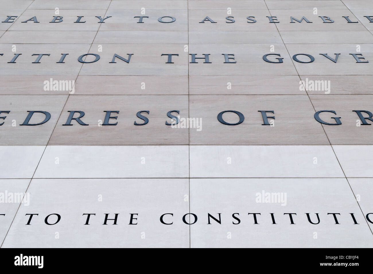 WASHINGTON DC, USA - The exterior of the Newseum in Washington DC features a large extract carved in stone of the First Amendment to the Constitution that provides for freedom of the Press. The Newseum is a 7-story, privately funded museum dedicated to journalism and news. It opened at its current location on Pennsylvania Avenue in April 2008. Stock Photo