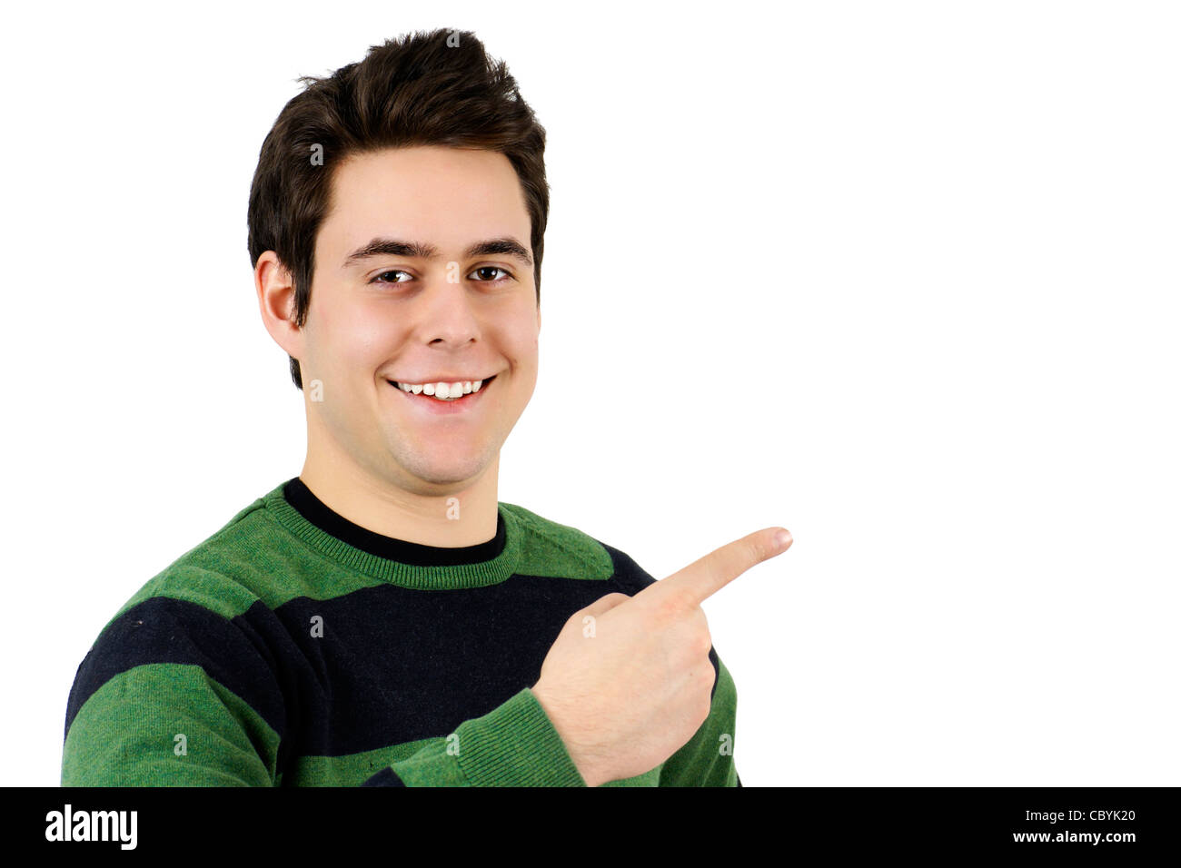 Handsome young man or cute student pointing at blank white space, perfect for advertising Stock Photo