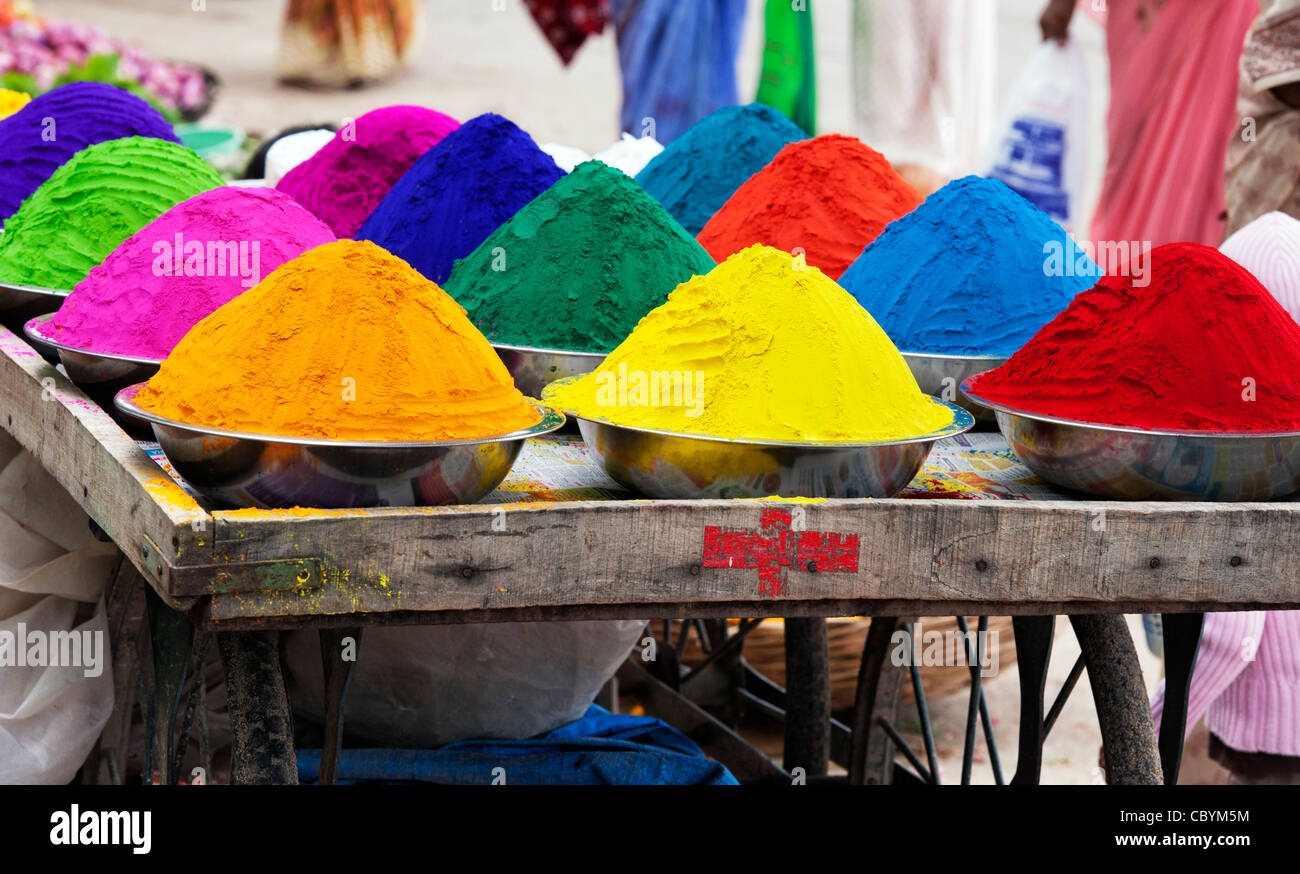 Coloured Indian powder in metal bowls used for making rangoli designs at festivals Stock Photo