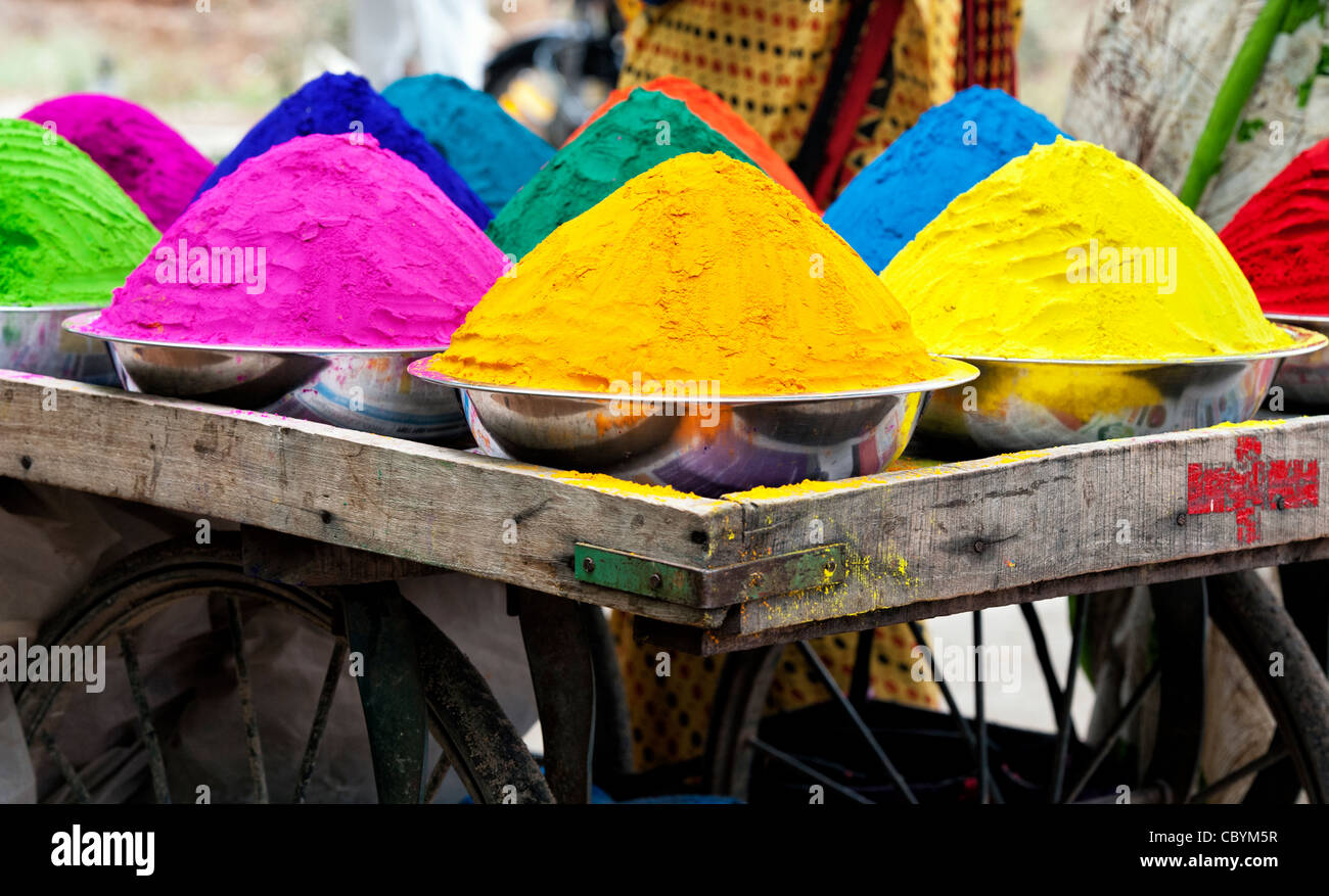 Coloured Indian powder in metal bowls used for making rangoli designs at festivals Stock Photo