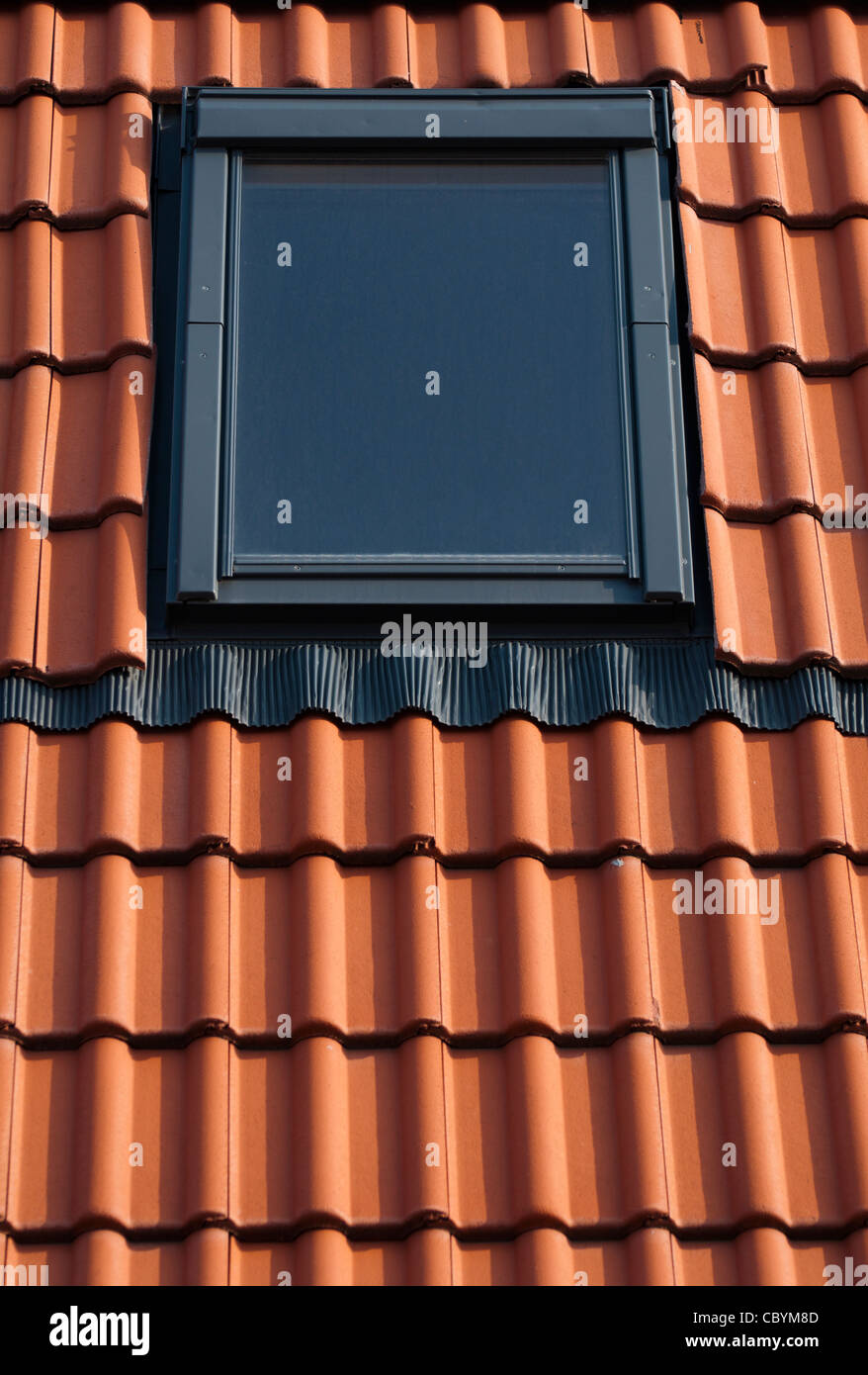 Dormer on a red tiled roof Stock Photo