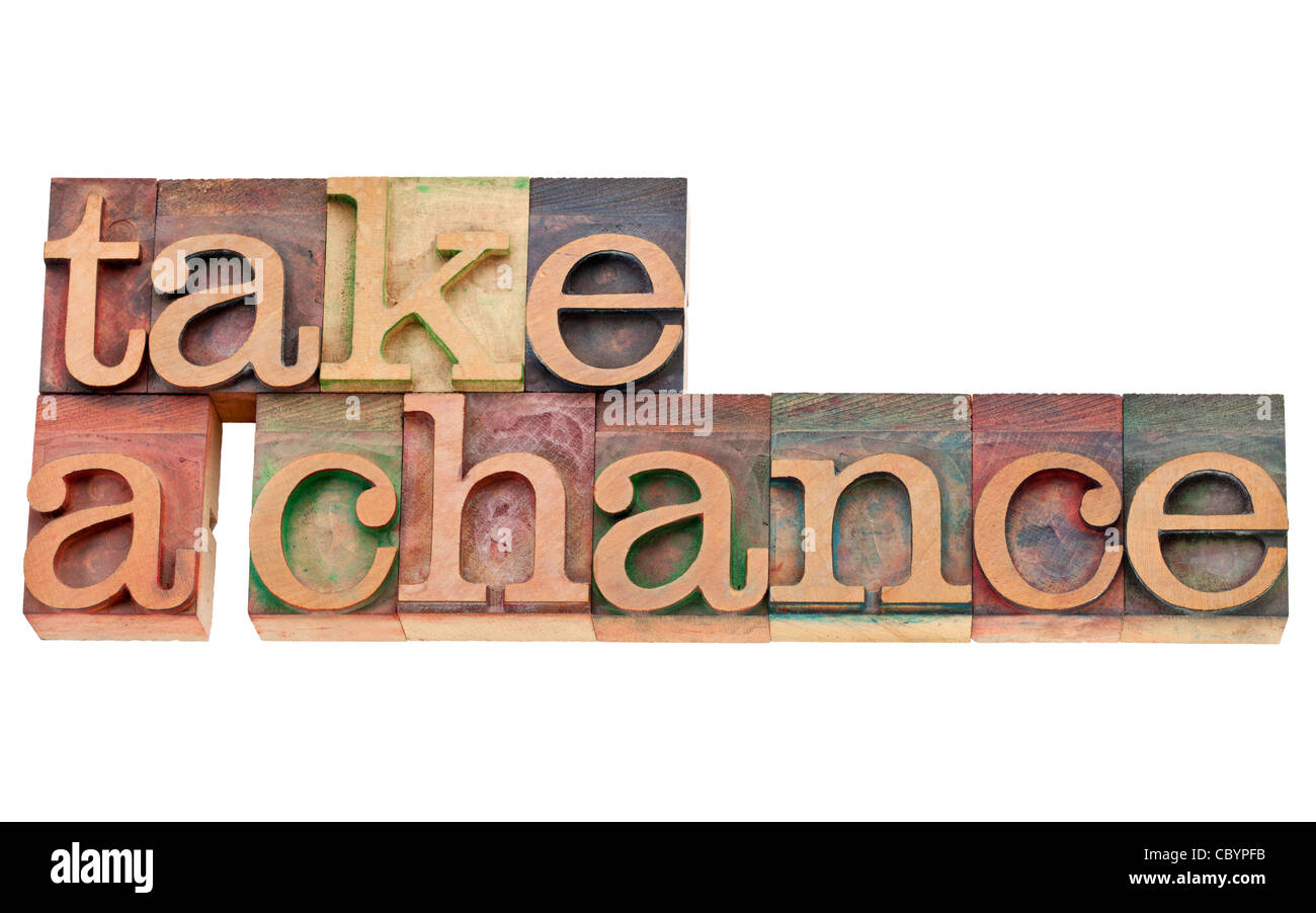 take a chance encouragement - isolated text in vintage wood letterpress type, stained by color inks Stock Photo