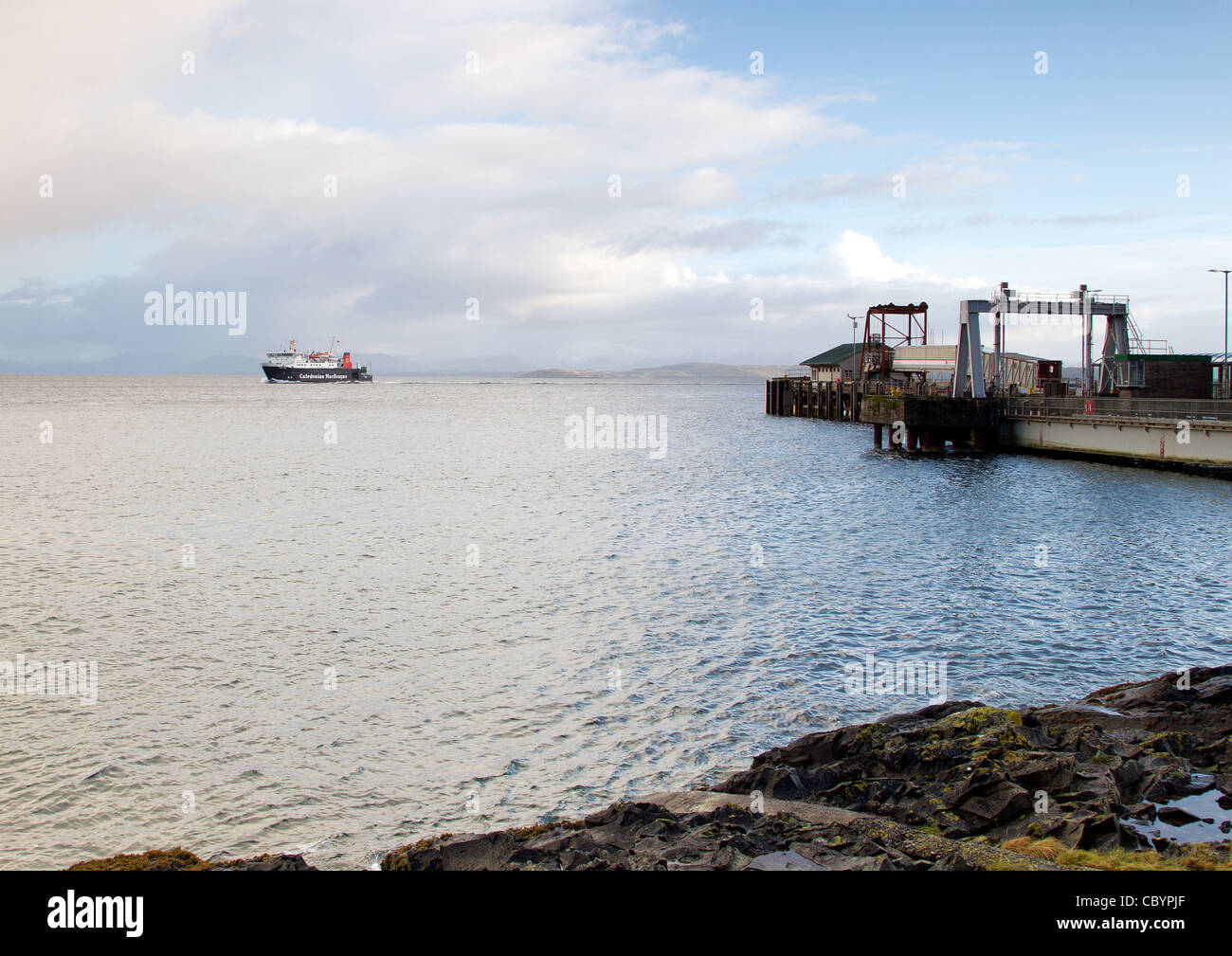 Calmac Ferry Caledonian MacBrayne leaves Craignure Mull Harbour for Oban Rainbow Stock Photo
