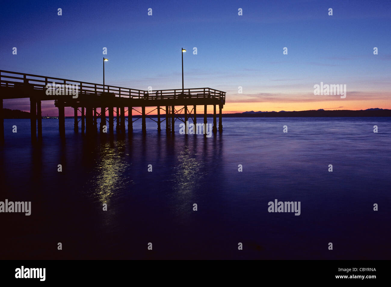Silhouetted fishing pier at sunset Rodondo beach Washington State USA Stock Photo