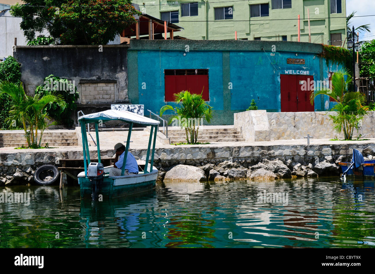 FLORES, Guatemala - The waterfront of Flores in north Guatemala. The colonial-era town is on a small island in Lake Peten Itza, joined with the mainland by a single causeway. Stock Photo