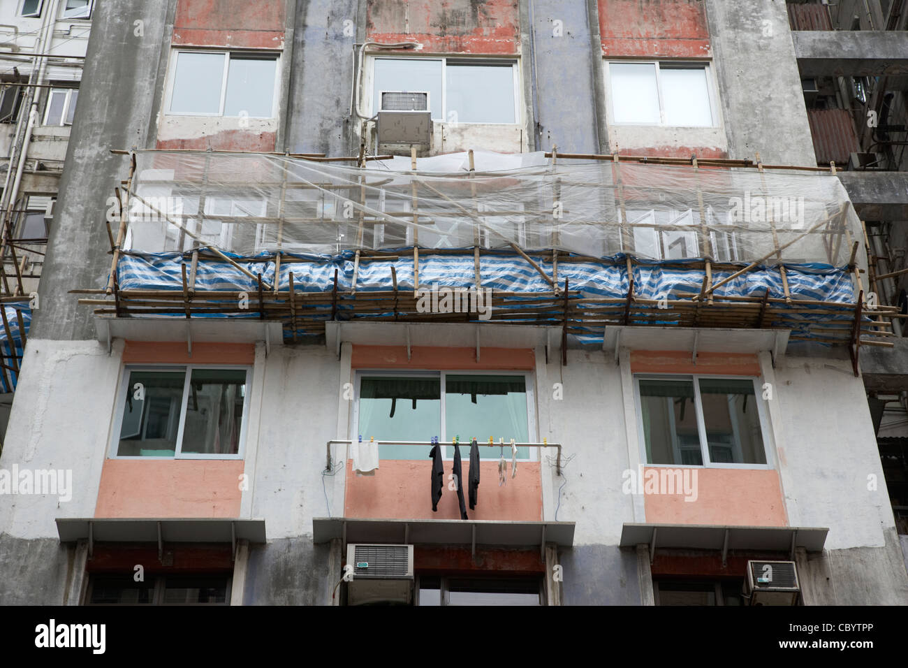 bamboo scaffolding on hong kong high rise hi density apartments hksar china asia Stock Photo