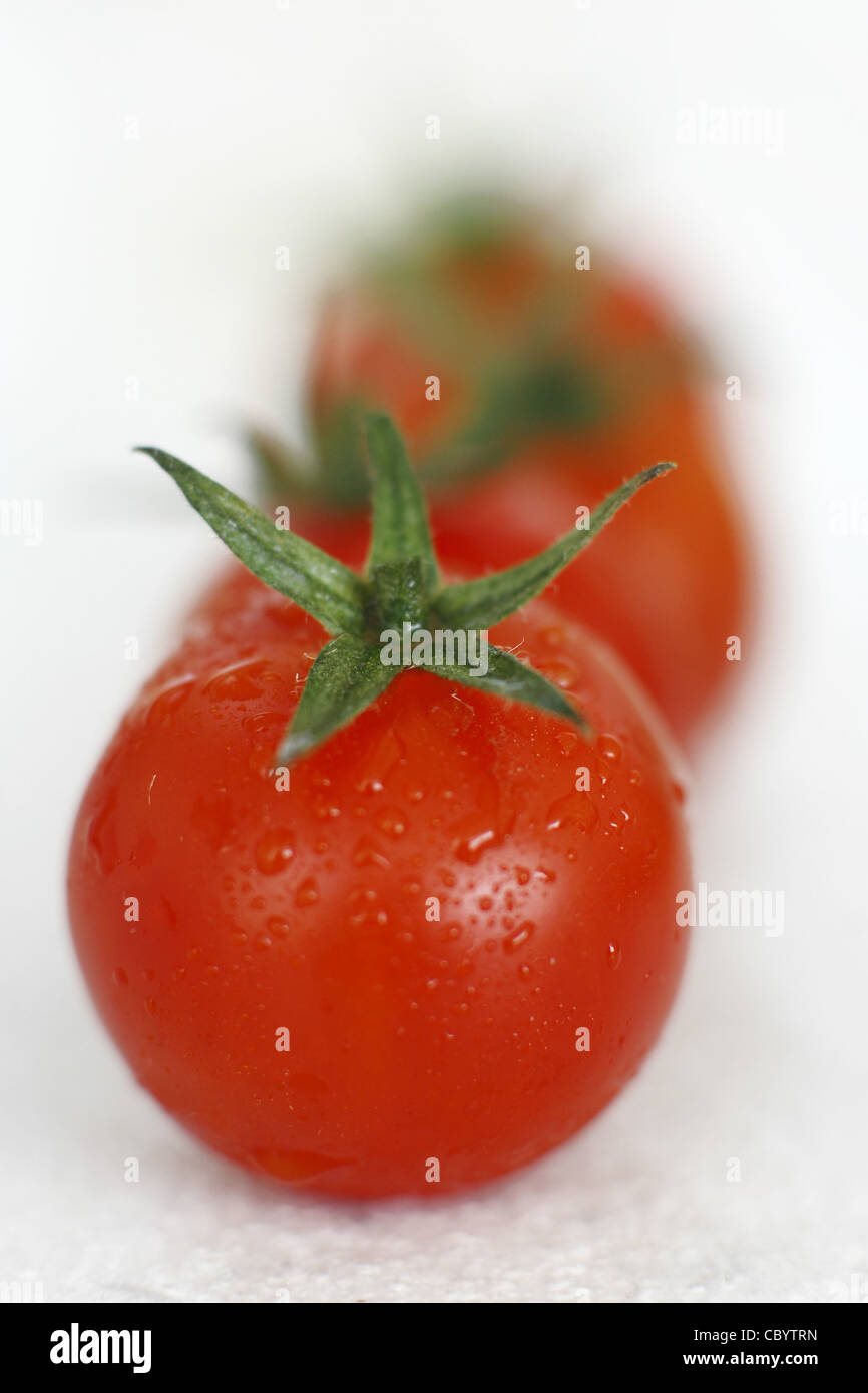 ROUND TOMATO, BOTH A FRUIT AND A VEGETABLE, IT CONTAINS LYCOPENE, A POWERFUL ANTIOXIDANT GOOD