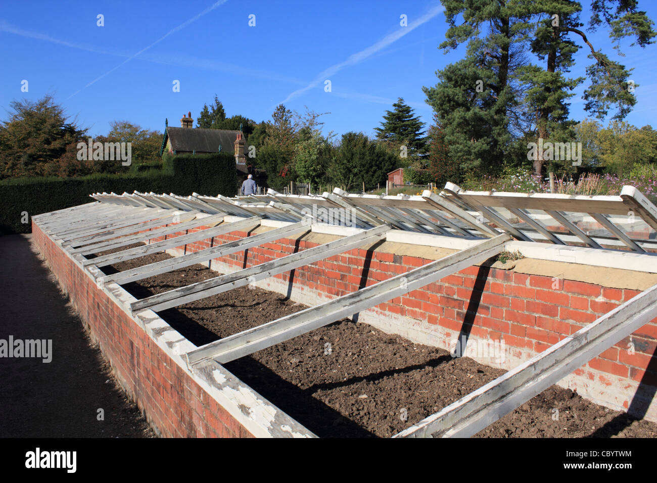 Brick and glass cold frame in country garden, Surrey England UK Stock Photo