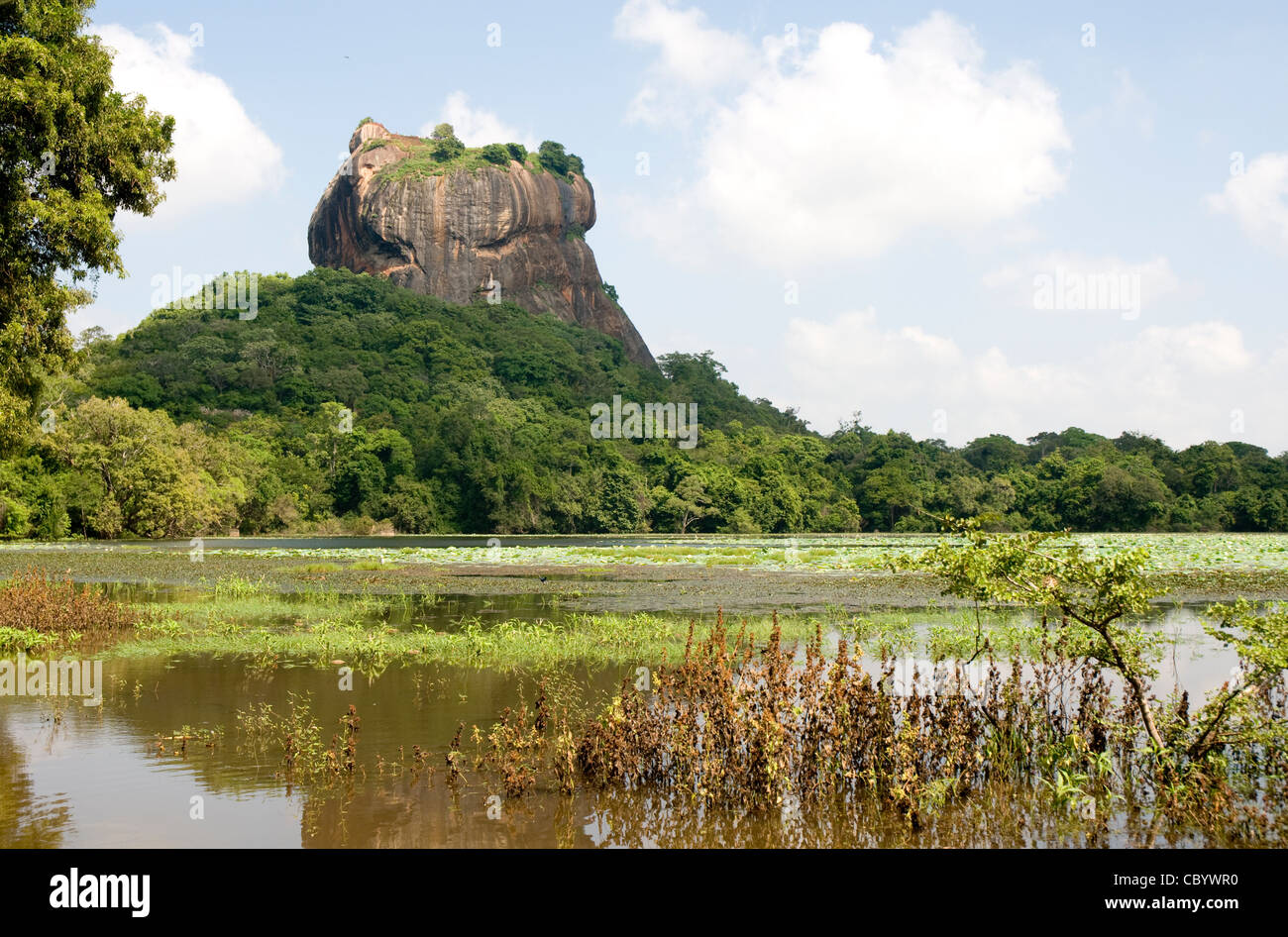 Sigiriya (Lion's rock), Sri Lanka. Seen cross the natural outer moat at the south of the cliff. Stock Photo