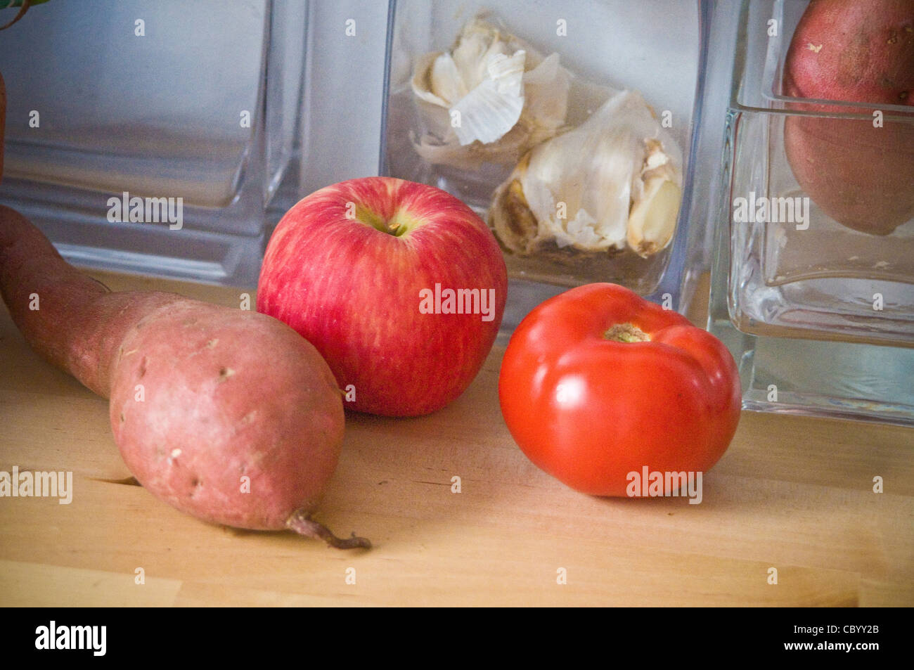 Kitchen counter, fresh, fruit, vegetable, sweet potato, tomato, peach. Stock Photo