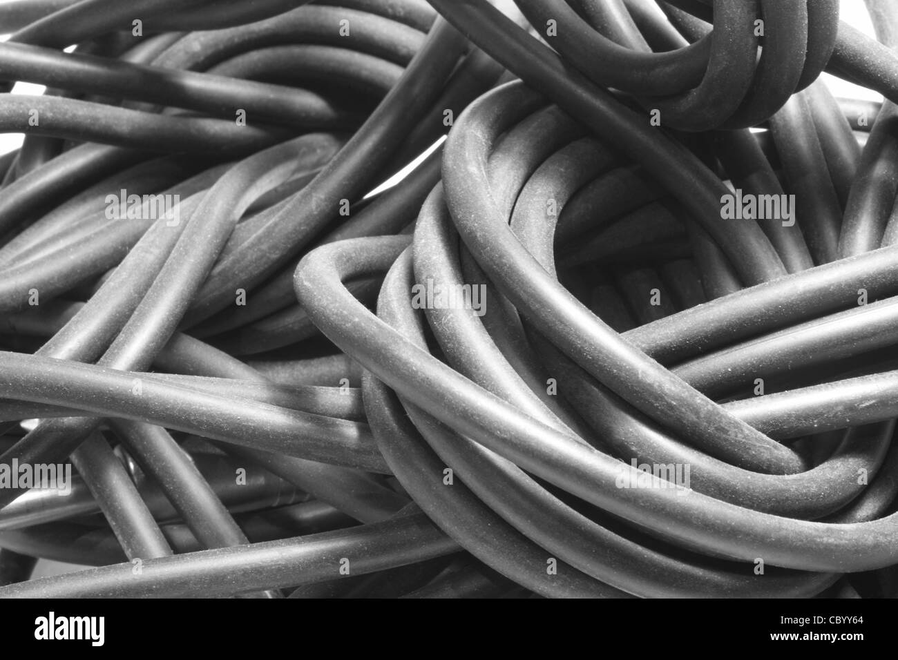 full frame detail of a old dusty audio cable entanglement Stock Photo