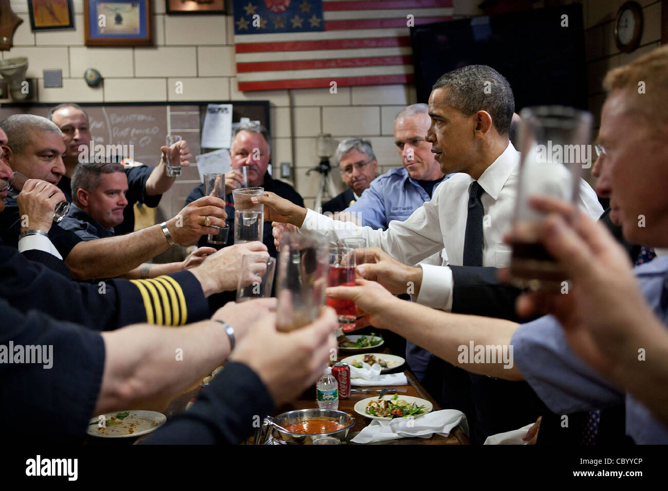 President Barack Obama toasts families of 9/11 victims and the fireman of Battalion 9 May 5, 2011 in New York City, NY. The visit was to mark the death of Osama bin Laden killed 4 days earlier by US Special Forces. Stock Photo