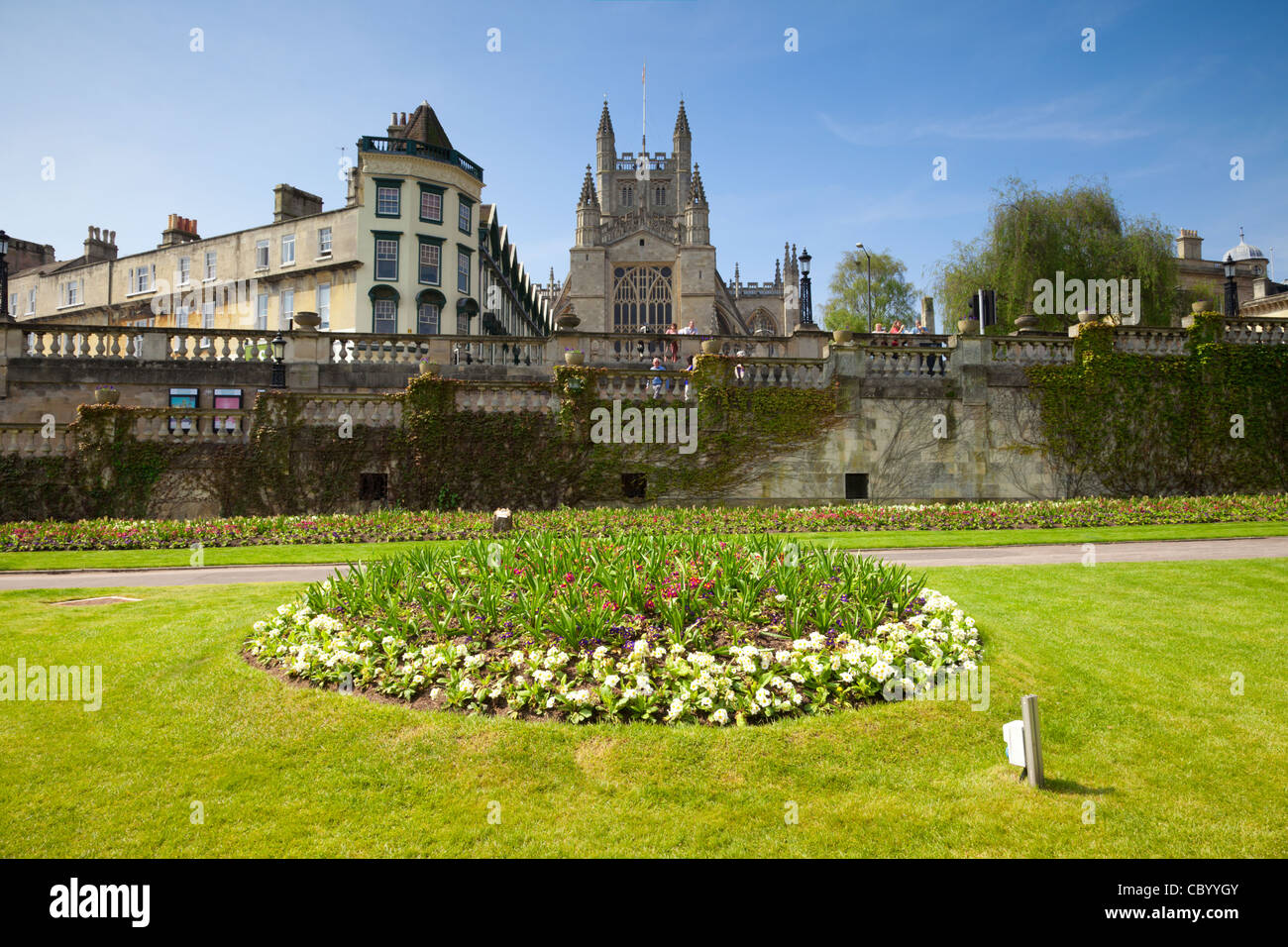 Formal flower bed in Parade Gardens, with Bath Abbey and The Orangerie, on a beautiful spring day. Stock Photo