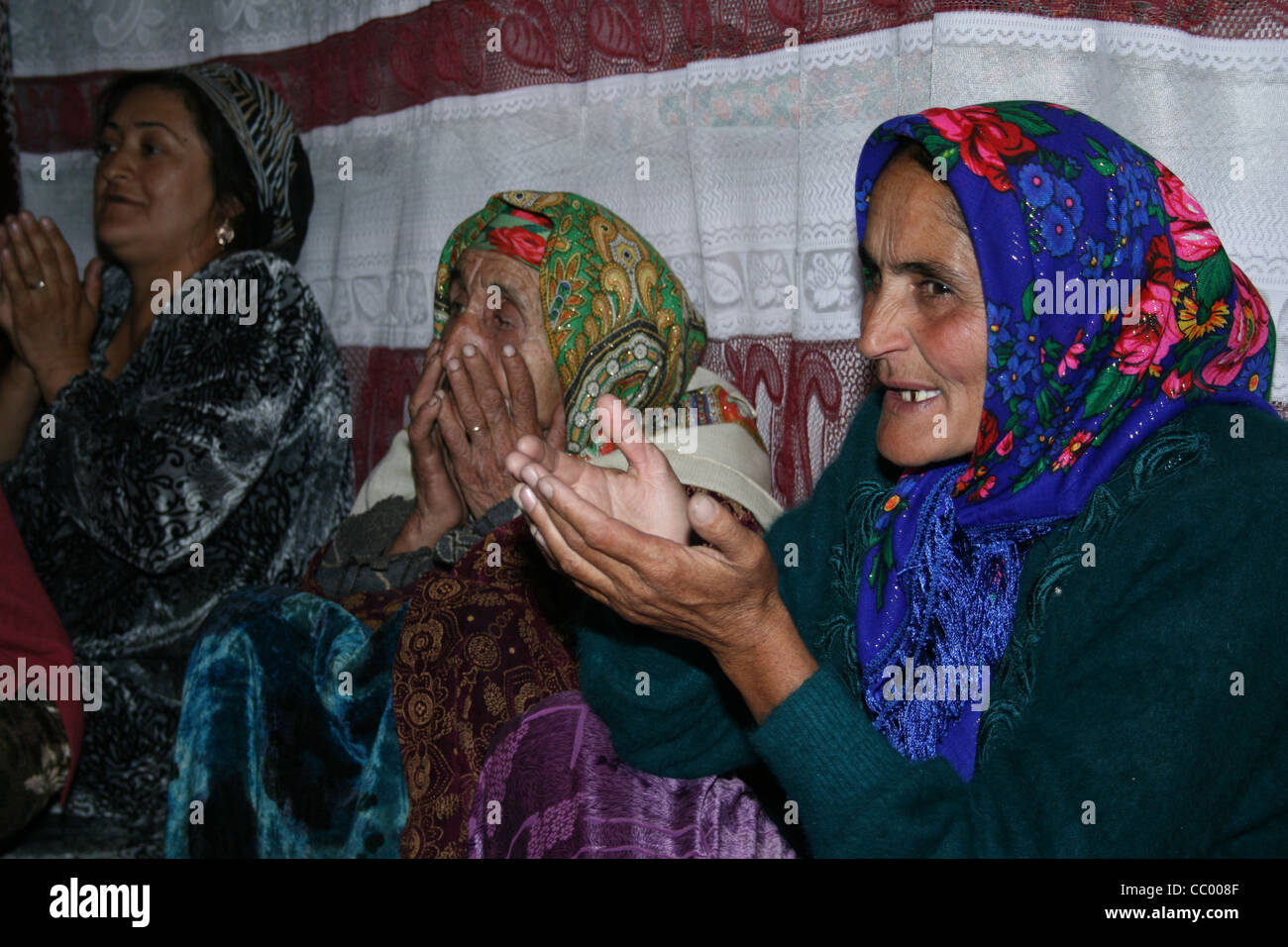 Women praying at wedding in Anzob village. Tadjikistan Stock Photo