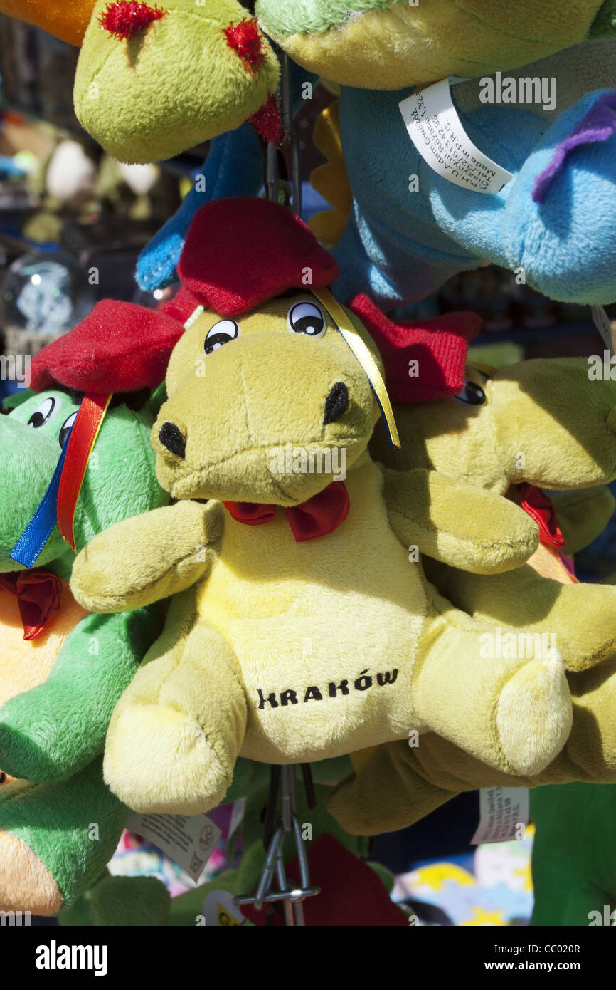 STUFFED ANIMAL REPRESENTING THE MYTHICAL DRAGON OF WAWEL HILL, DISPLAY IN A SOUVENIR SHOP, CRACOW, POLAND Stock Photo