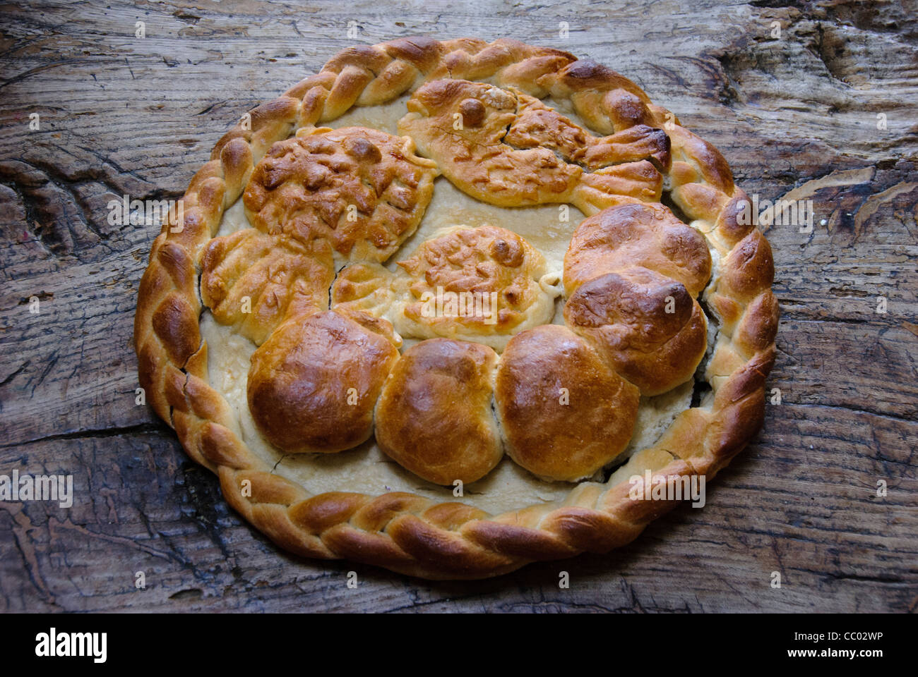 Home made ornamental harvest loaf with motif of five loaves and two