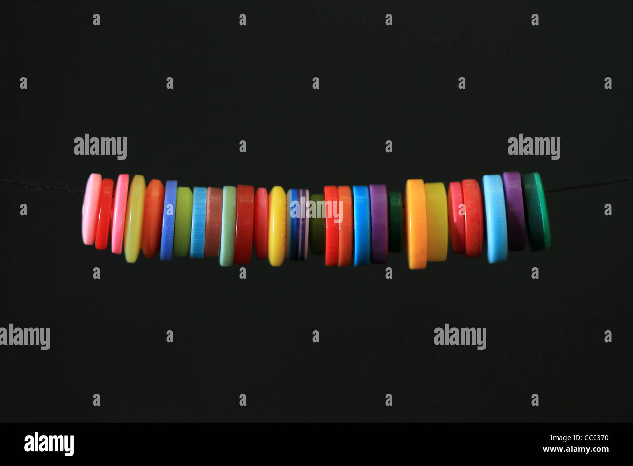 Colourful buttons with a black background Stock Photo