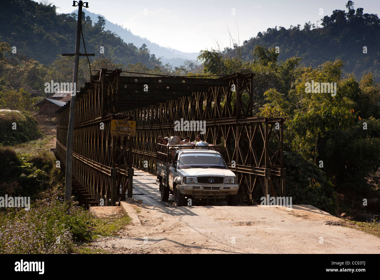 India, Arunachal Pradesh, Daporijo, tata pickup crossing old metal bridge over Subansiri river Stock Photo
