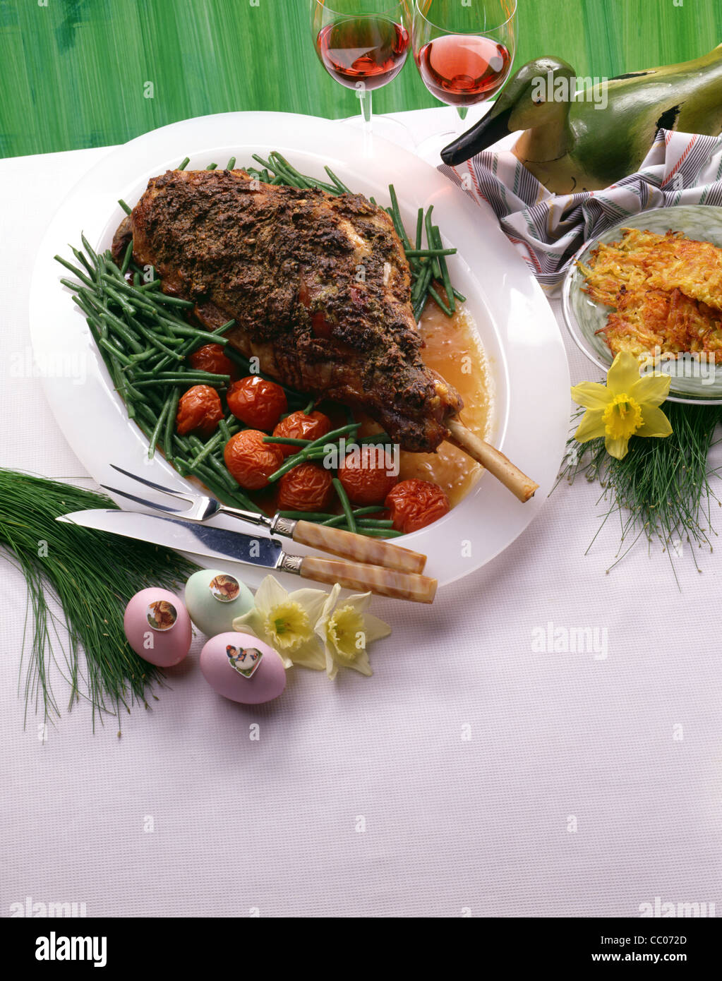 Lamb haunch with steamed tomatoes and green beans Stock Photo Alamy