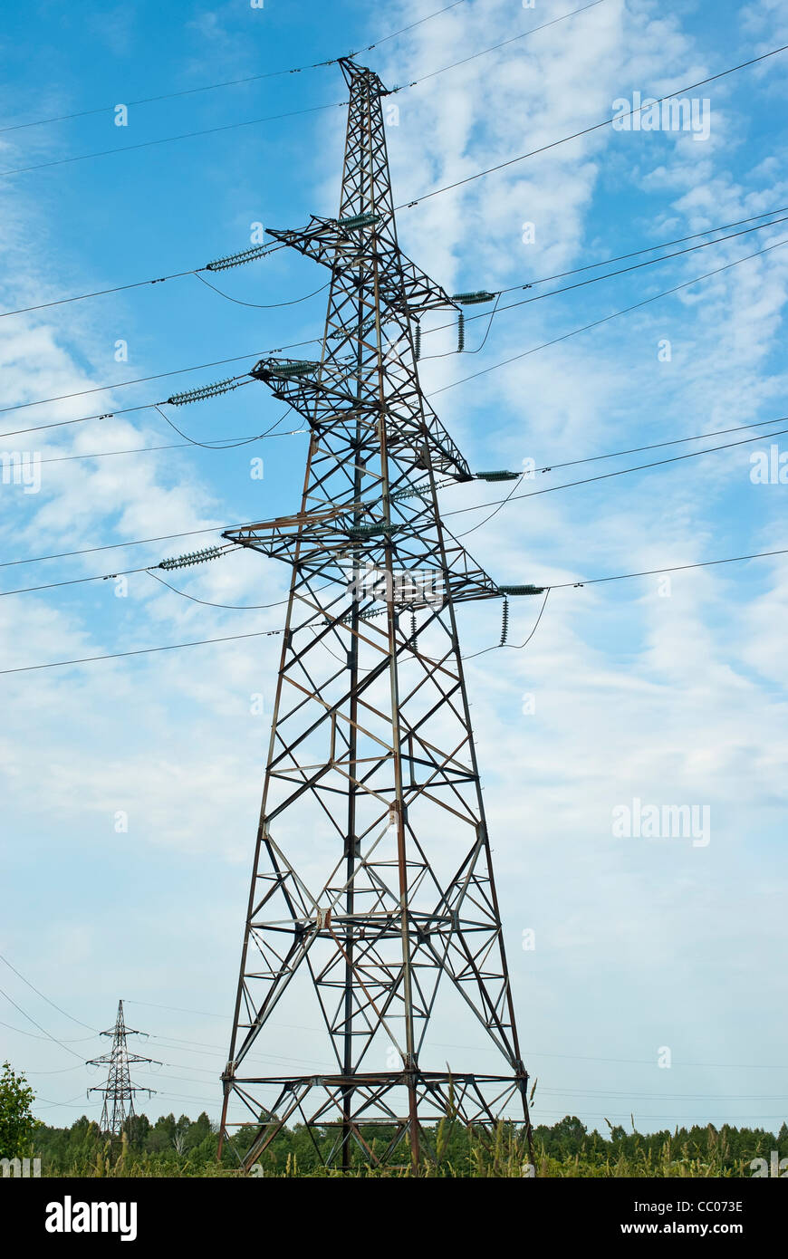 High voltage power lines over blue sky Stock Photo Alamy