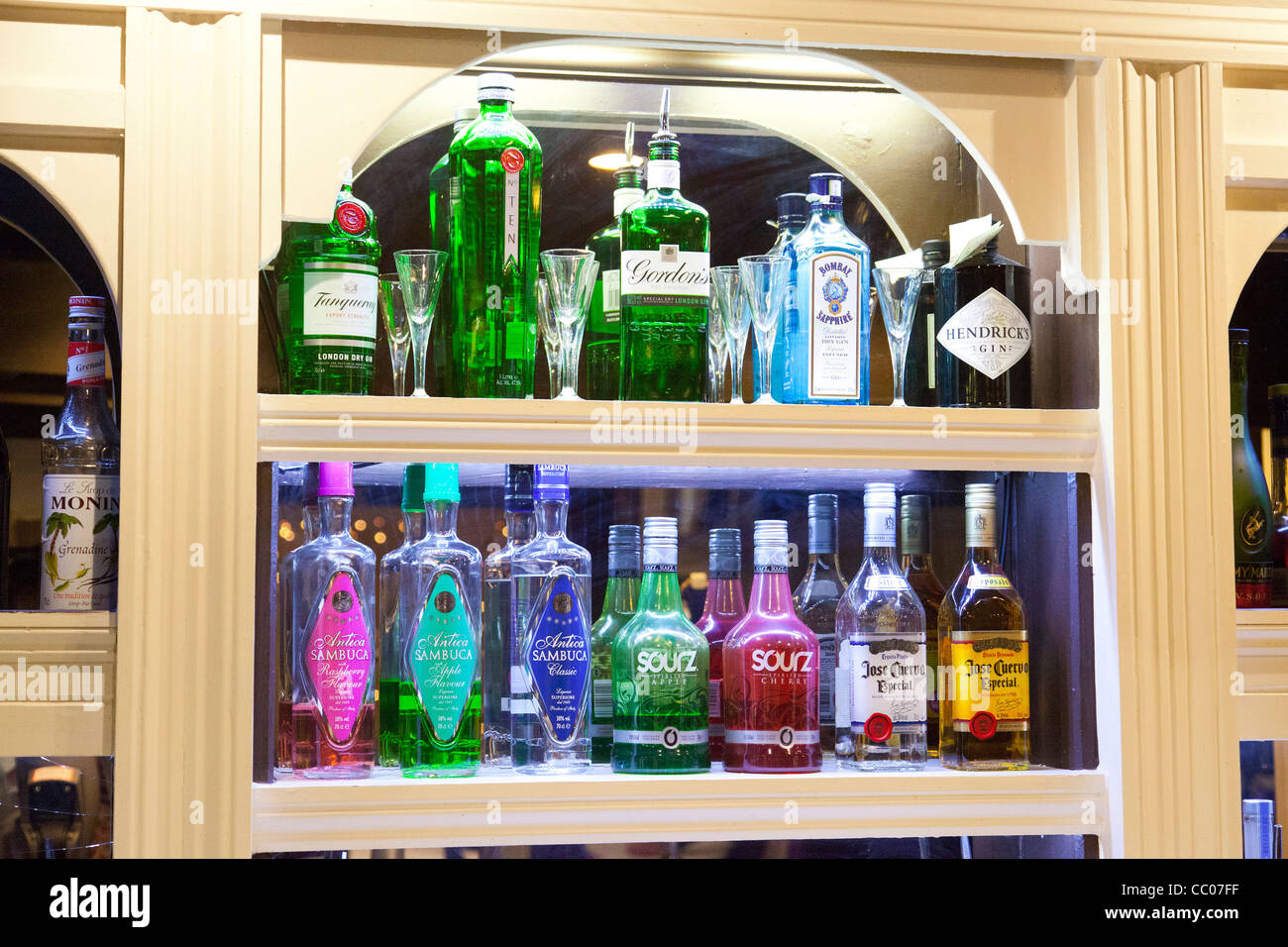 alcoholic drinks on display in empty bar in UK Stock Photo