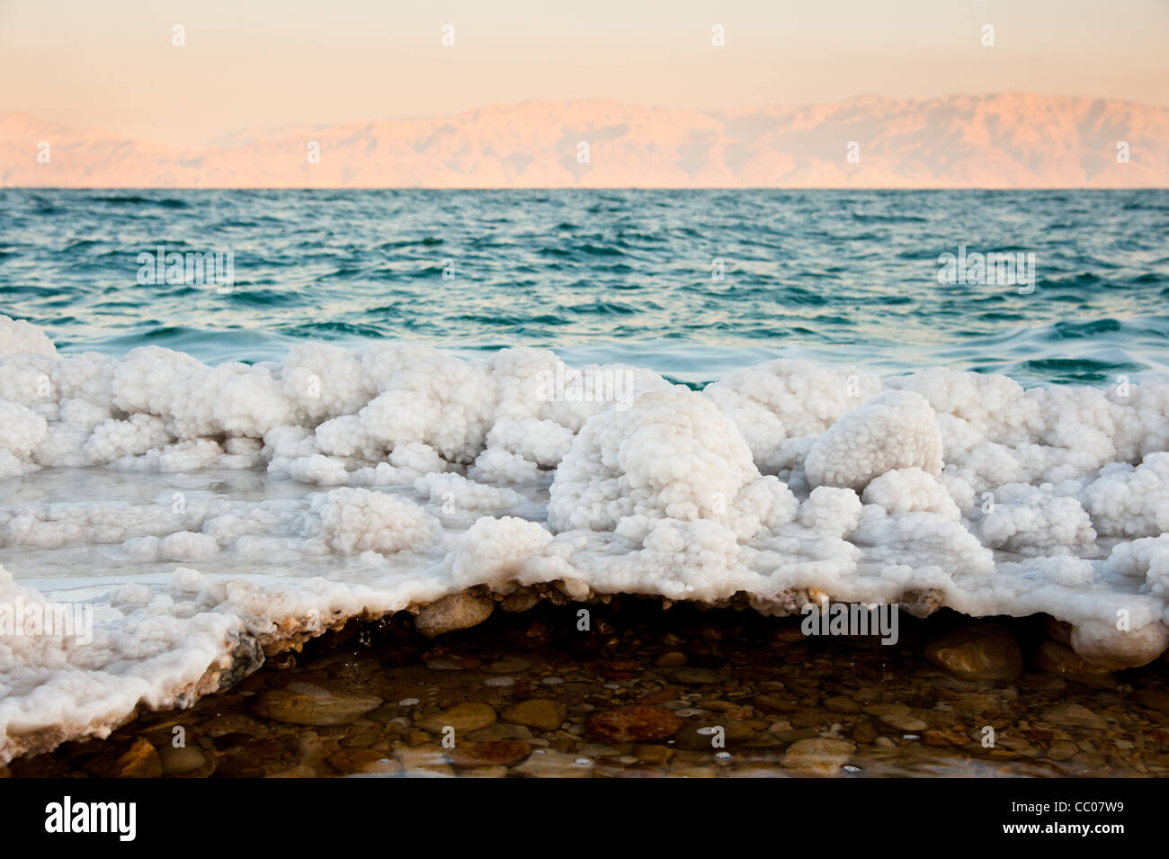 Salt-encrusted rocks along the shores of the Dead Sea at Ein Gedi, Israel. Stock Photo