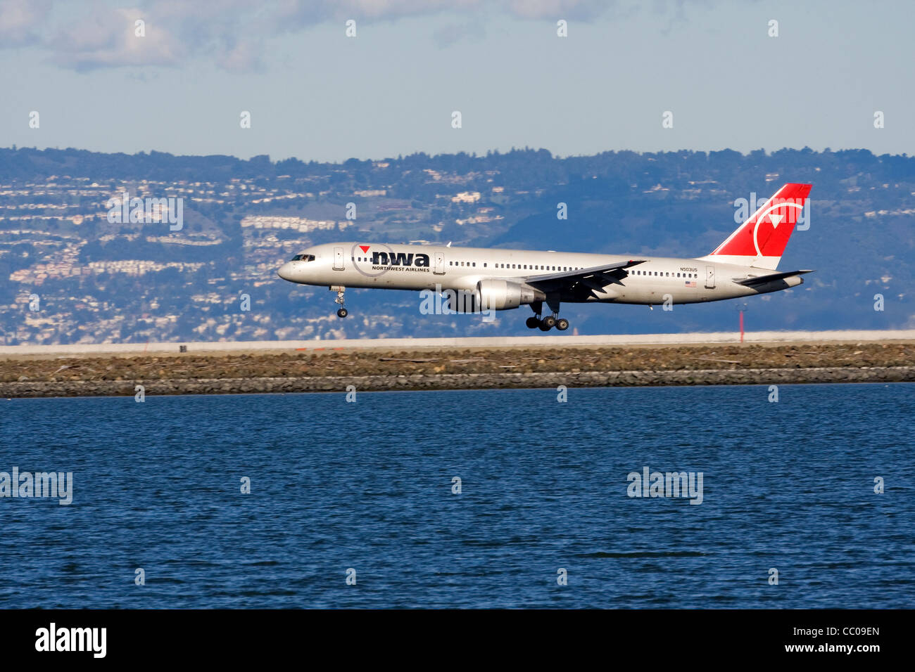 A commercial airplane lands at San Francisco International Airport in California. Stock Photo