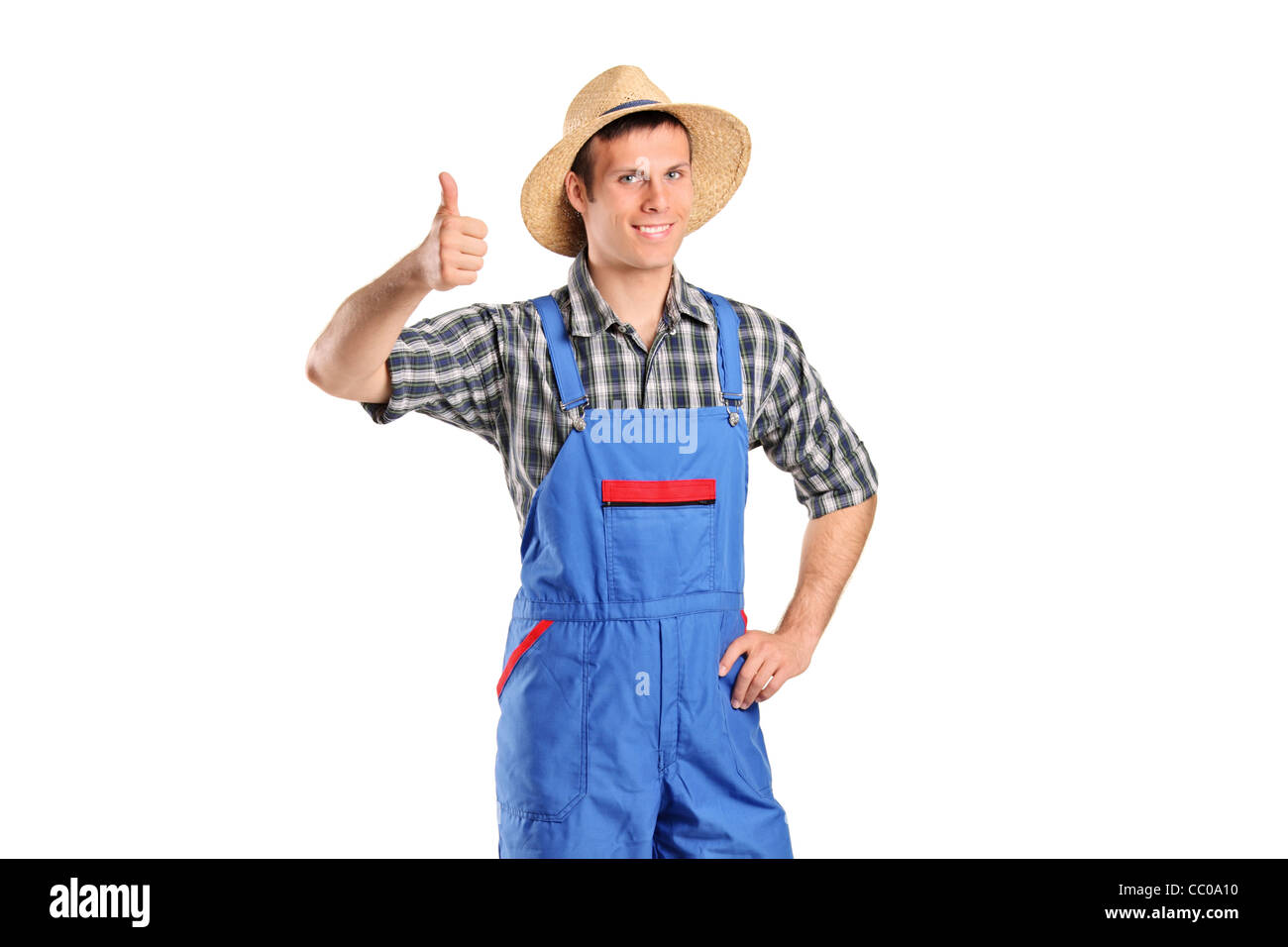 A young smiling farmer giving a thumb up Stock Photo - Alamy