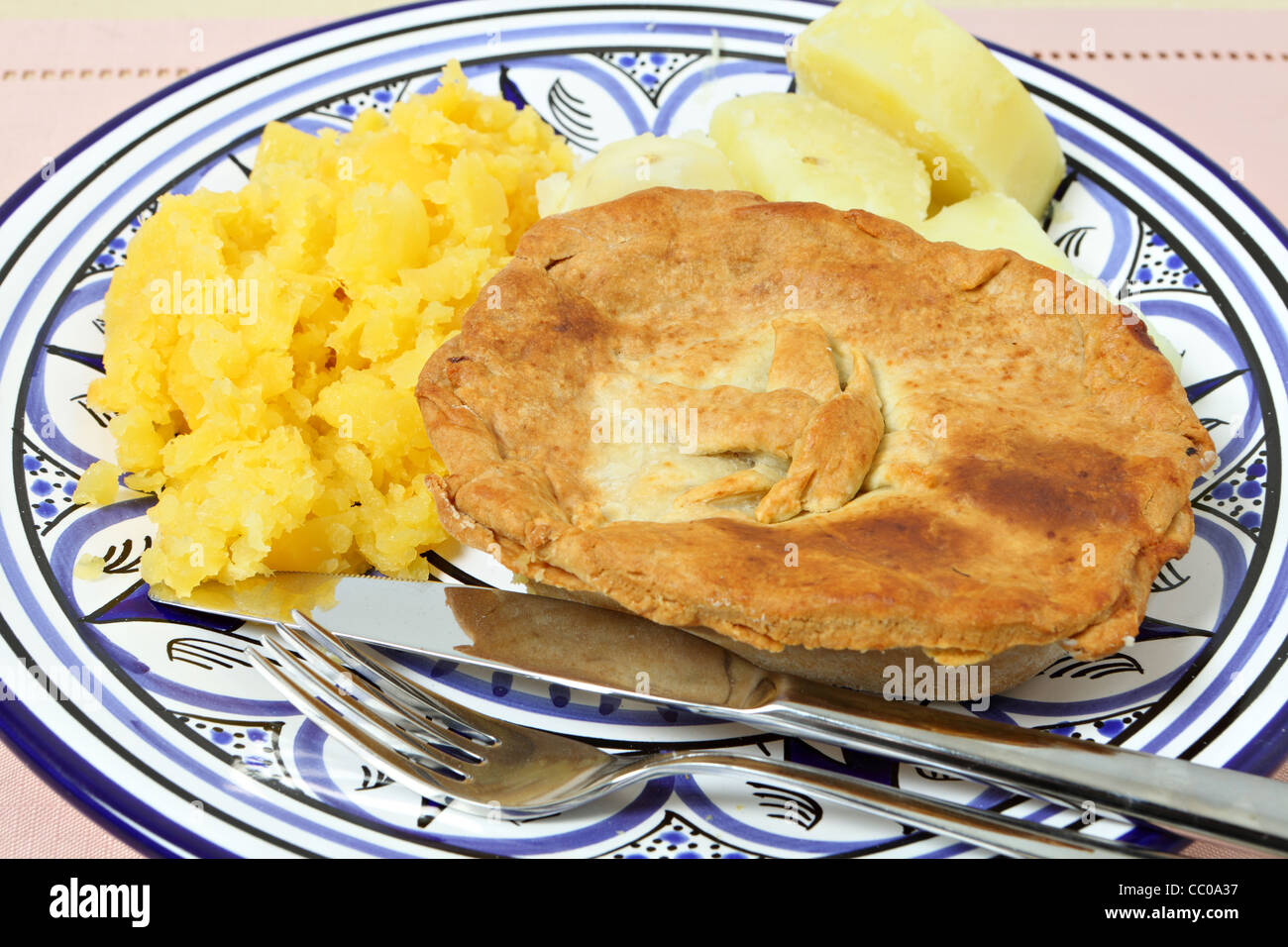 A homemade pie with swede (rutabaga) and boiled potato Stock Photo