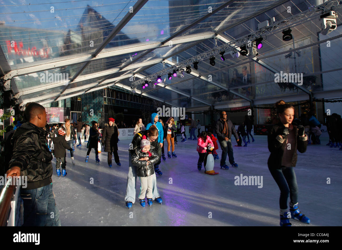 Shoppers ice skating at at Westfield shopping mall in Stratford City