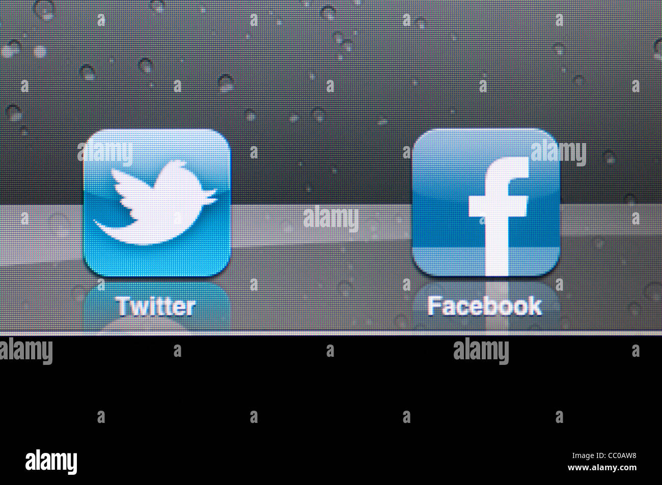 Facebook and twitter icons on iPad2 Apple tablet Stock Photo