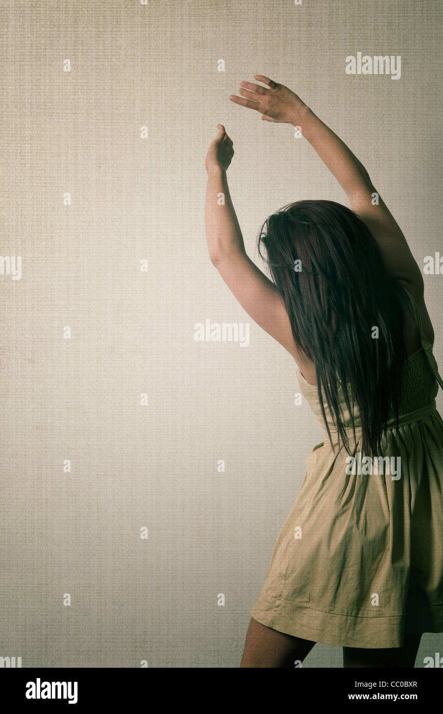 Woman raising arms rear view Stock Photo - Alamy