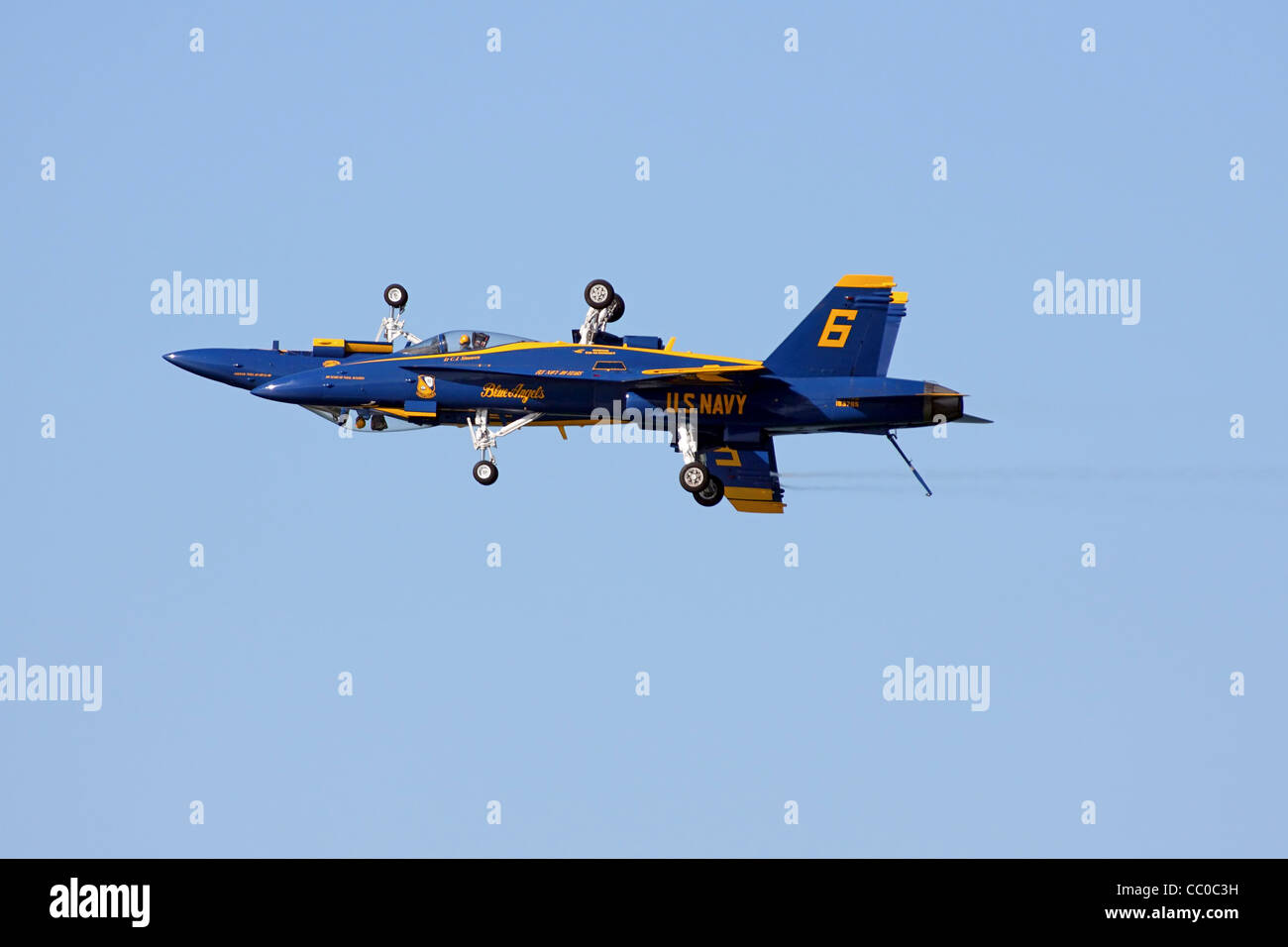 Blue Angel's solo pilots execute the mirror pass. Stock Photo