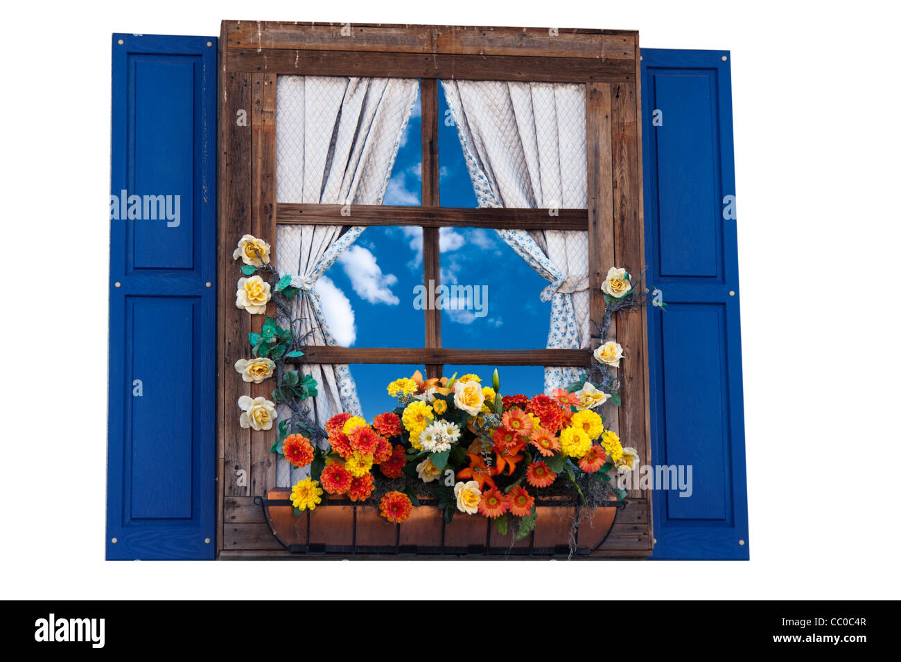 Country style window with flowers,planter, shutters and curtains,sky Stock Photo