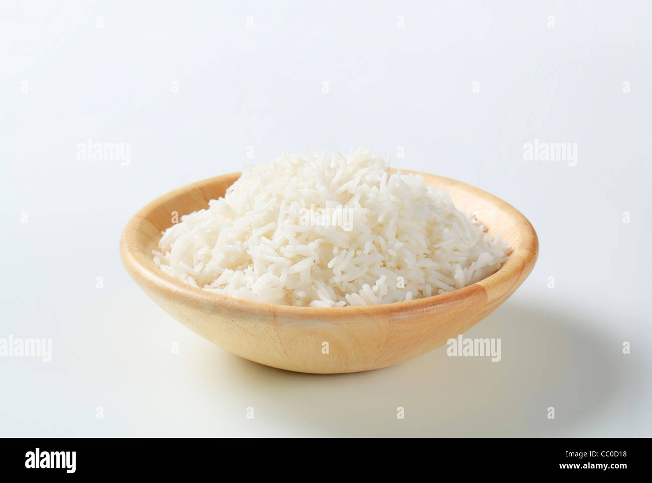 Boiled white rice in a wooden bowl Stock Photo